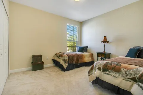 a bedroom with two beds and painted walls