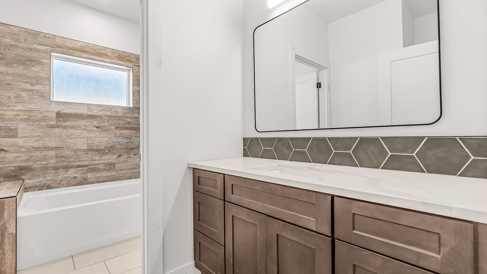 214 Limberpine Circle Parachute, CO 81635 - Photo 13 of 24 a bathroom with a sink and a mirror
