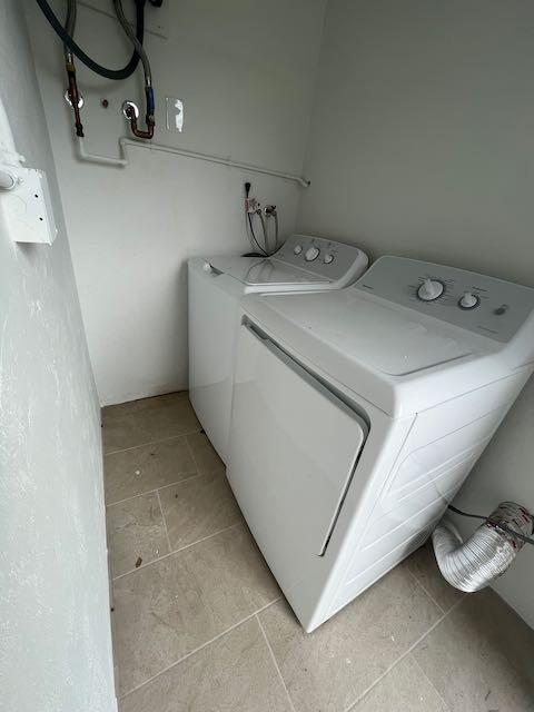 1611 Johnson Street, Unit 2 Lake Worth Beach, FL 33460 - Photo 11 of 12 a utility room with dryer and washer