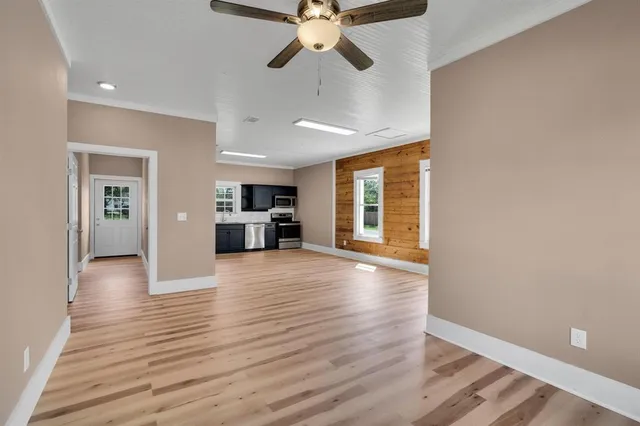 a view of a backyard with sitting area