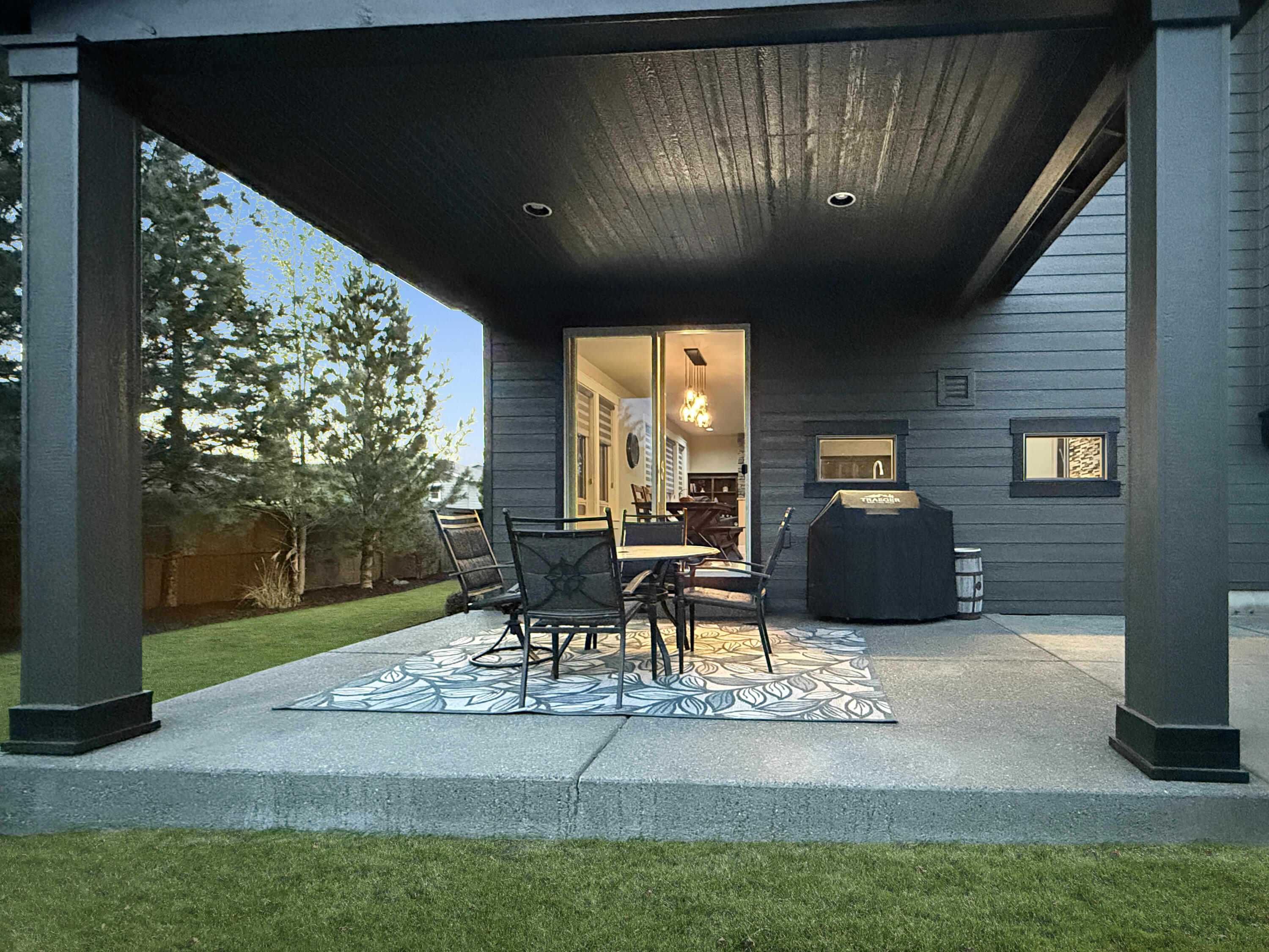 61072 Manhae Loop Bend, OR 97702 - Photo 45 of 63 a view of a patio with table and chairs and potted plants
