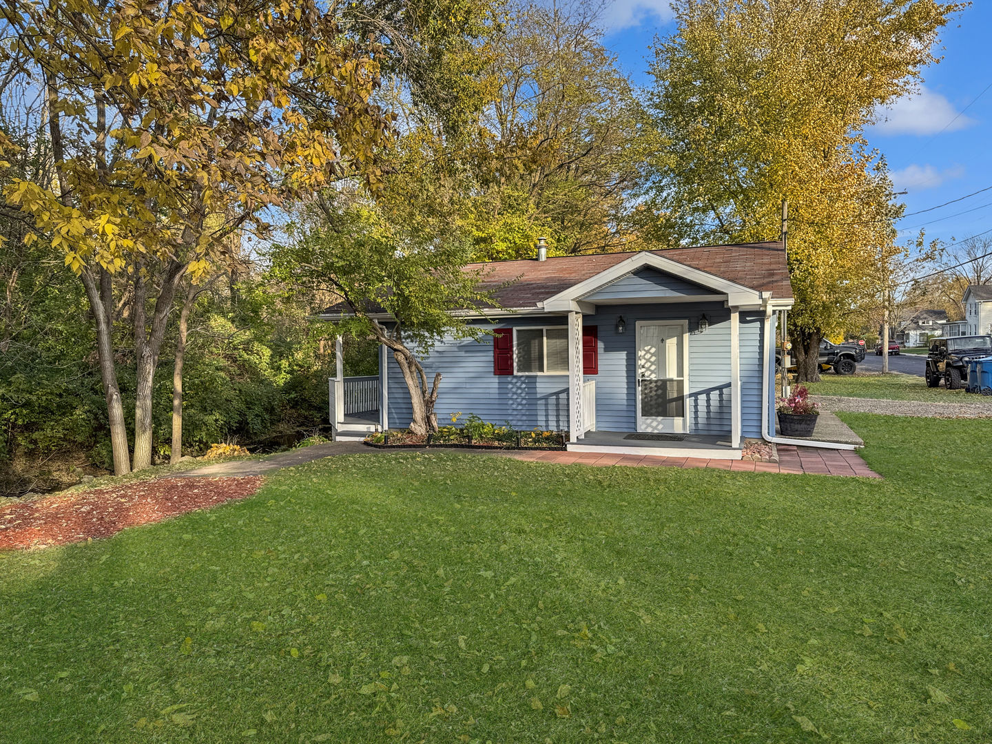 200 East Grove Street Utica, IL 61373 - Photo 1 of 42 a front view of a house with a yard