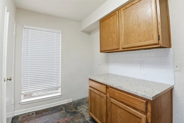 a kitchen with a sink and a window