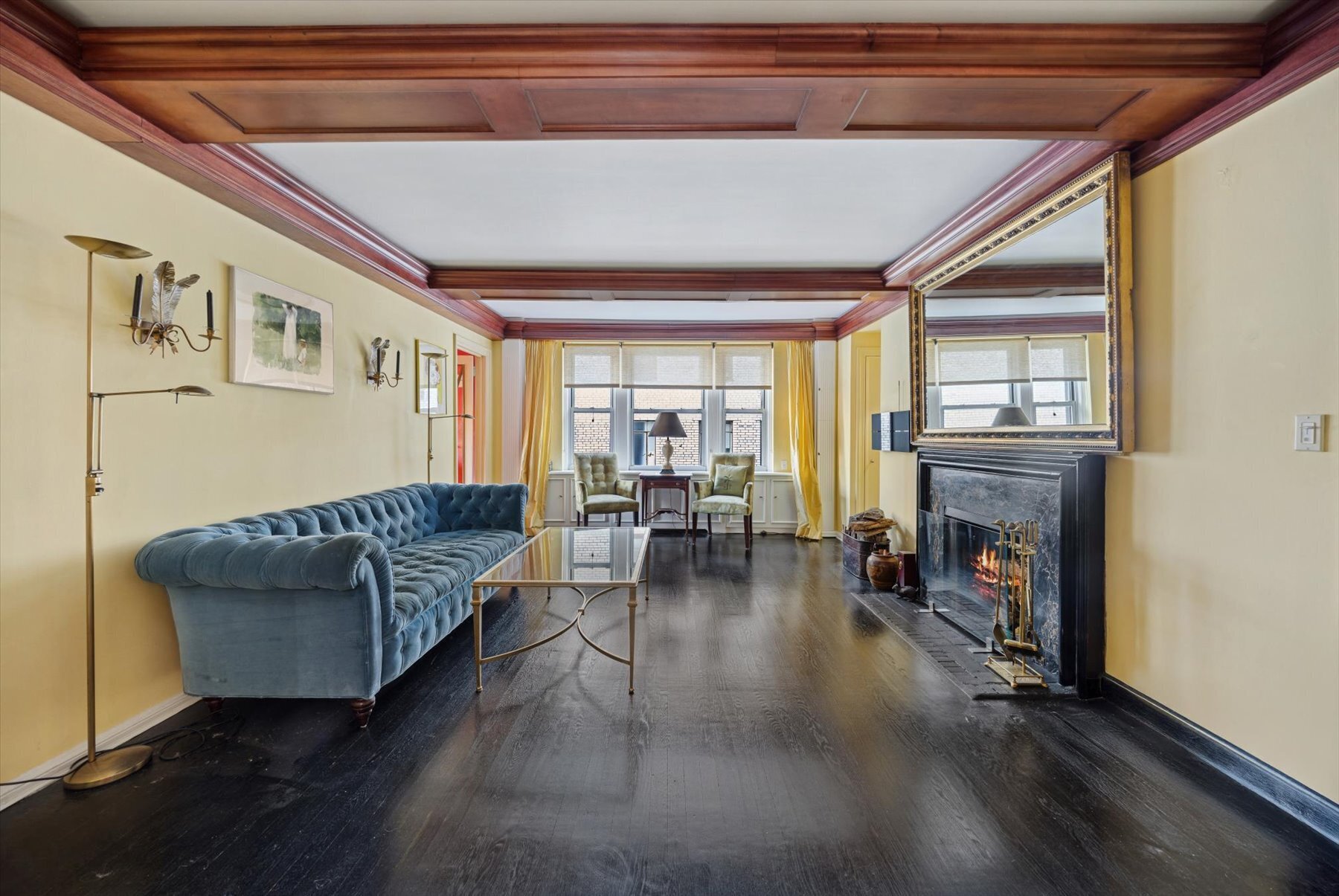 225 East 73rd Street, Unit 11D Manhattan, NY 10021 - Photo 2 of 12 a living room with furniture and a fireplace