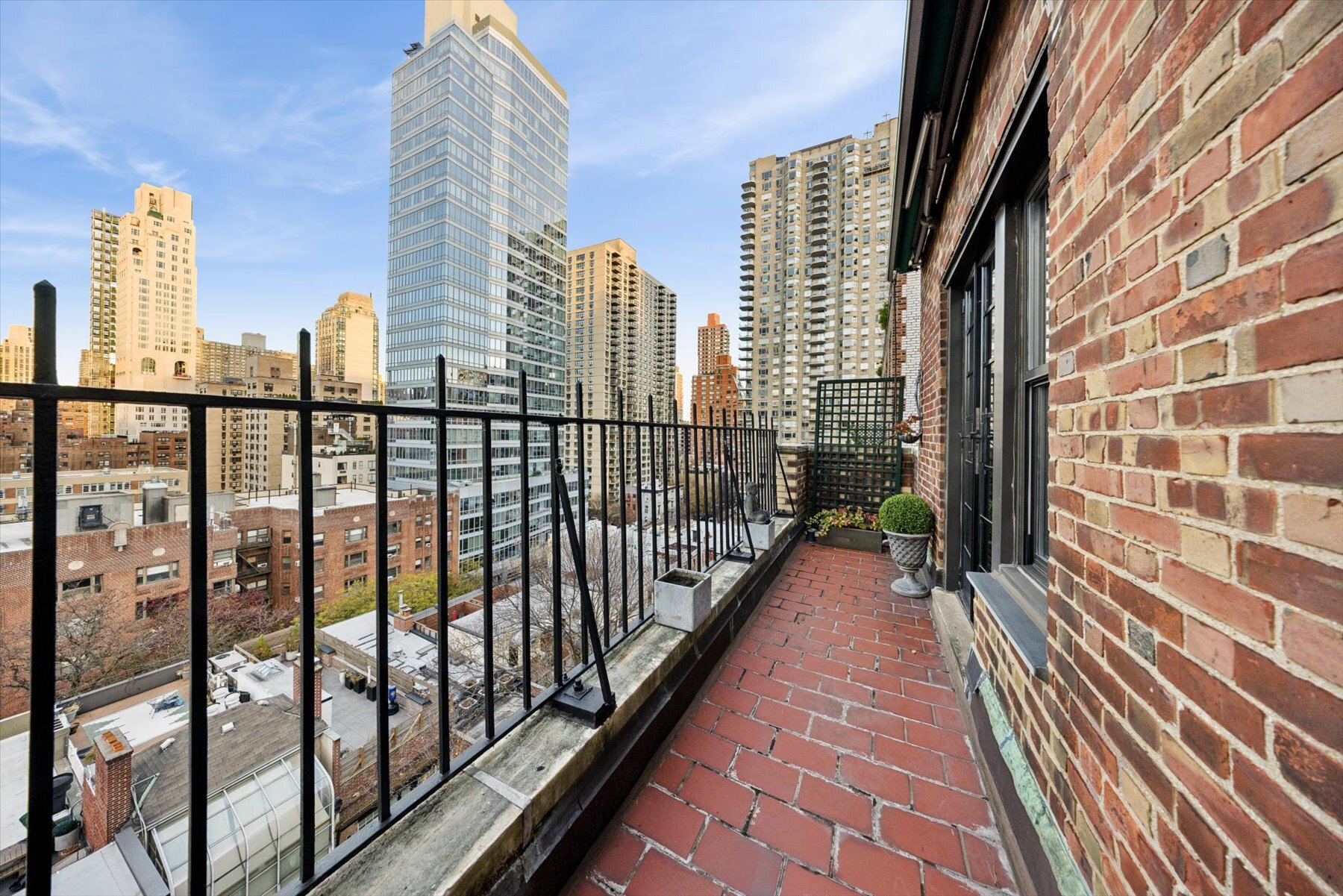 225 East 73rd Street, Unit 11D Manhattan, NY 10021 - Photo 9 of 12 a view of city with tall buildings