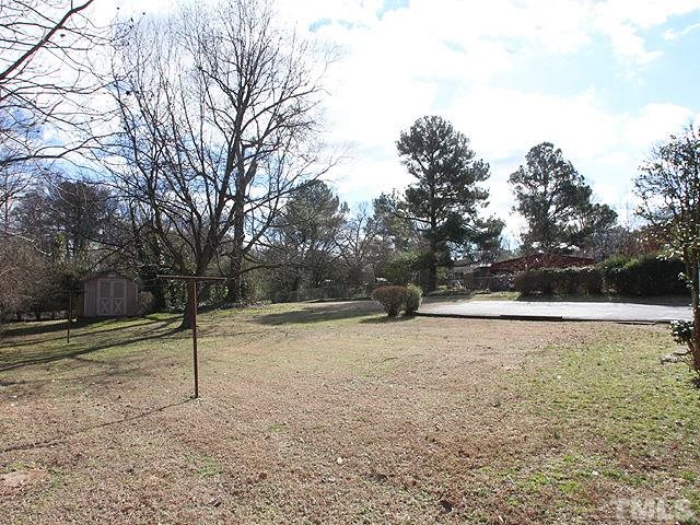 3609 Garner Road Raleigh, NC 27610 - Photo 12 of 13 Fenced Back Yard with storage building
