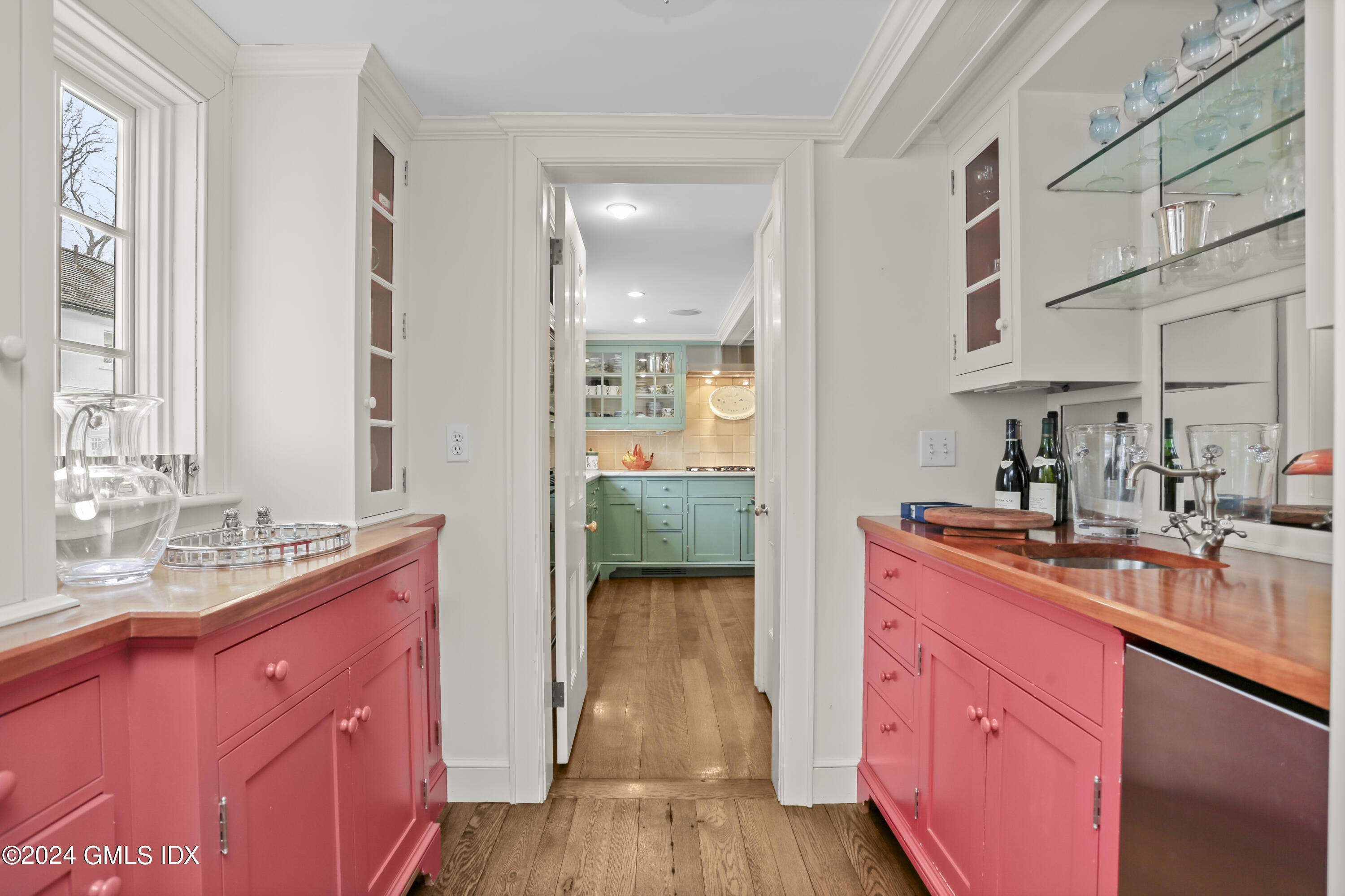 264 Taconic Road Greenwich, CT 06831 - Photo 11 of 36 a kitchen with stainless steel appliances granite countertop a sink stove and cabinets