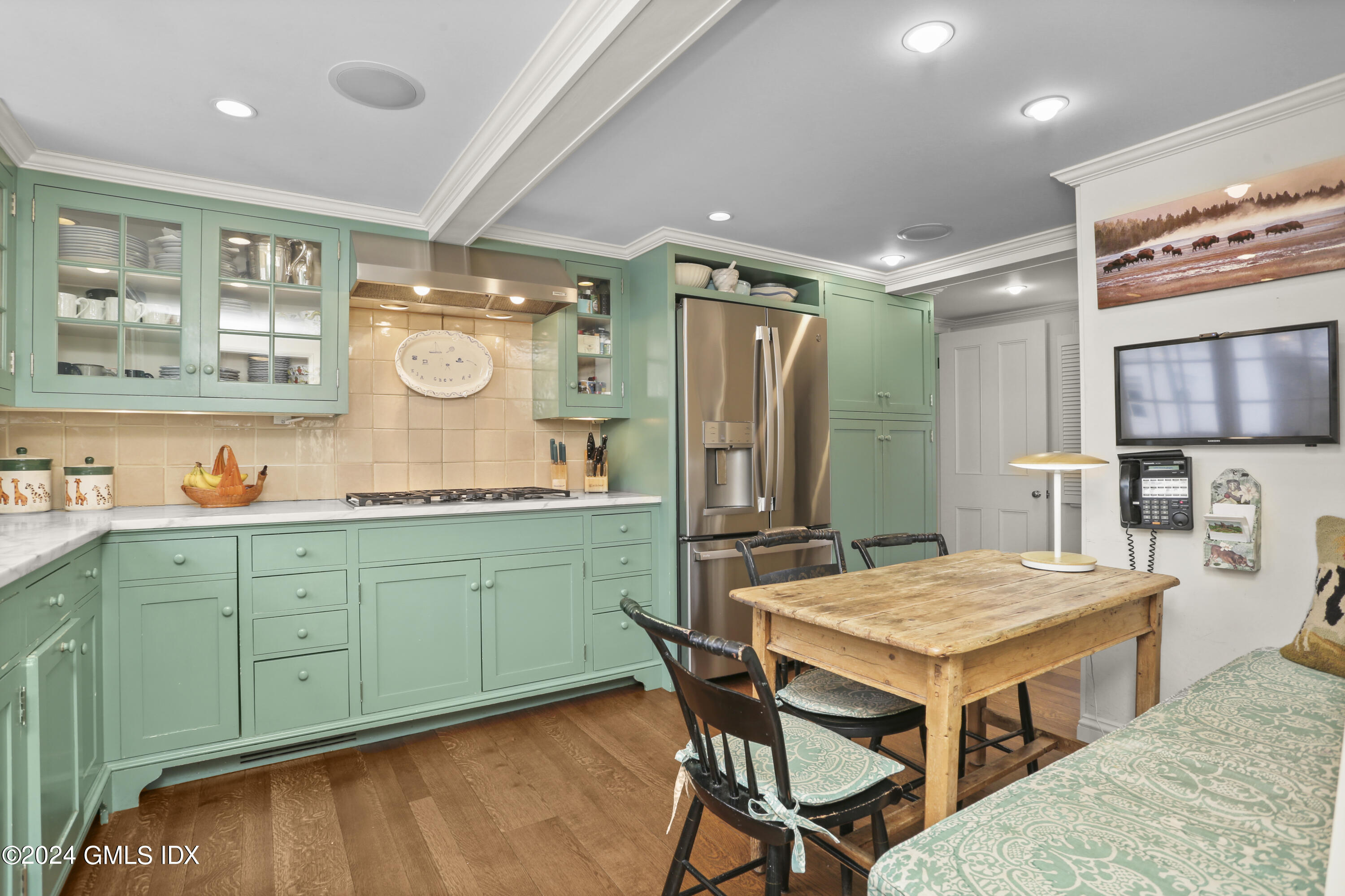 264 Taconic Road Greenwich, CT 06831 - Photo 13 of 36 a kitchen with cabinets and wooden floor