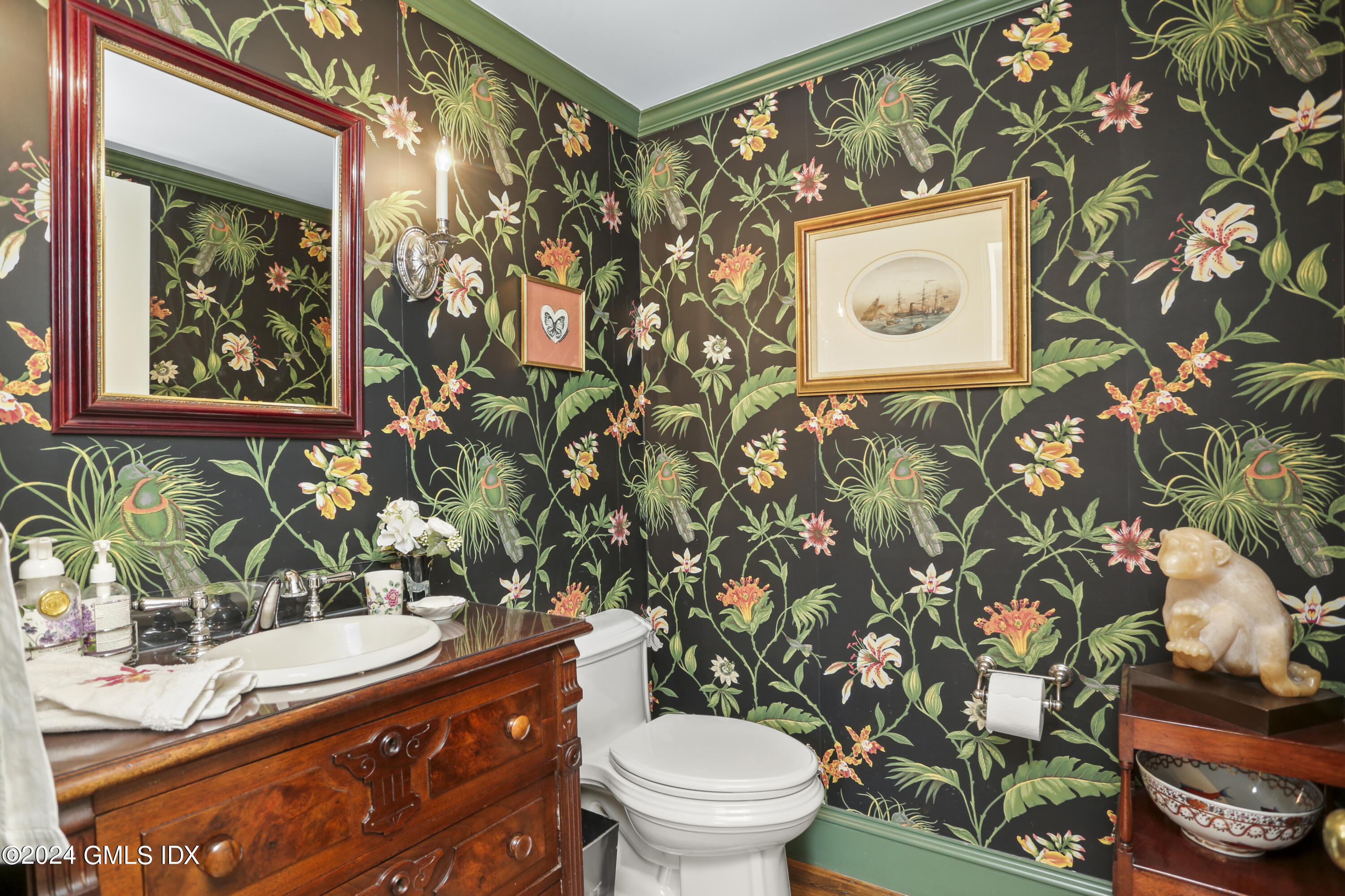 264 Taconic Road Greenwich, CT 06831 - Photo 14 of 36 a bathroom with a toilet sink and mirror