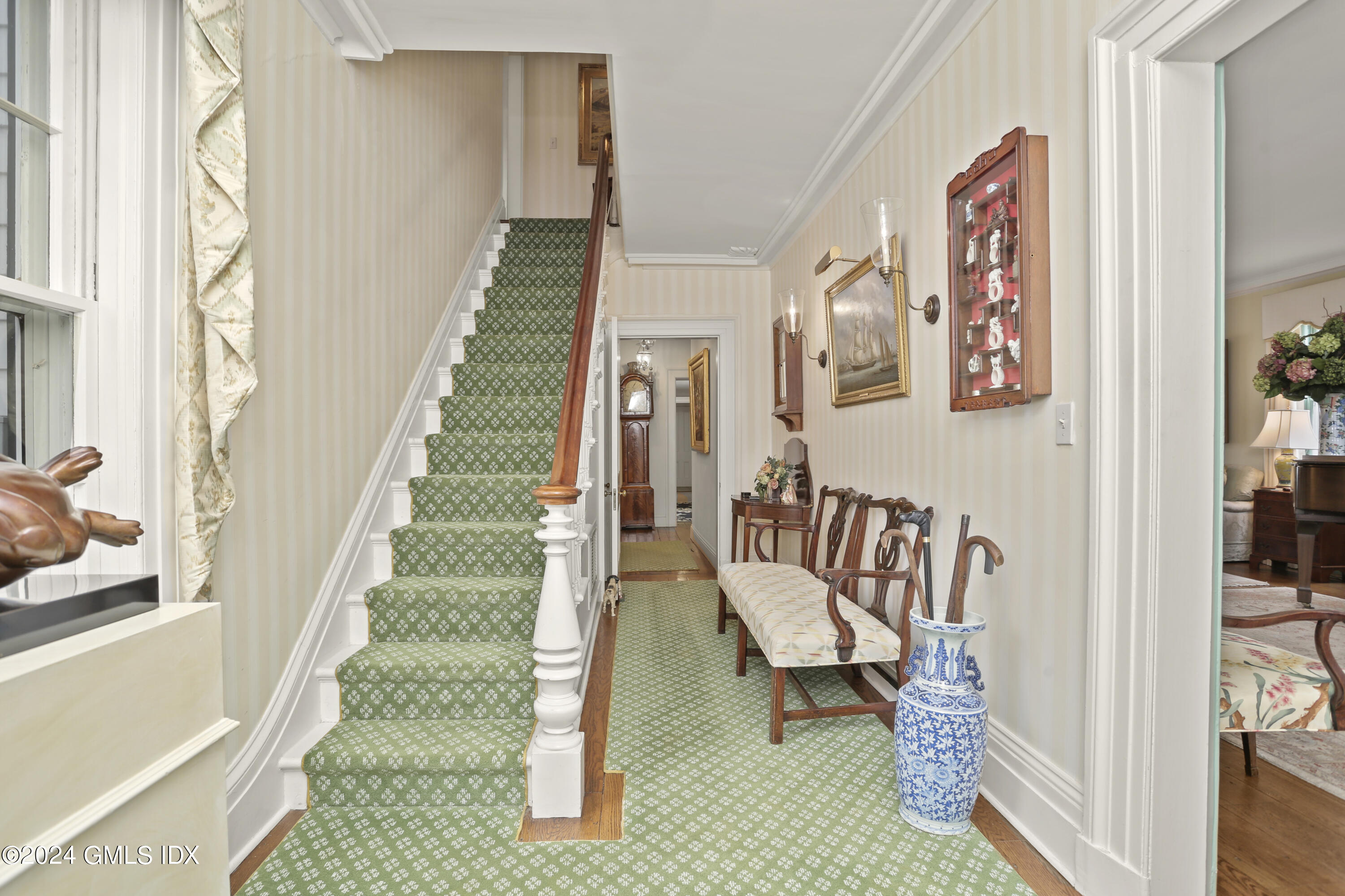 264 Taconic Road Greenwich, CT 06831 - Photo 15 of 36 a living room with furniture and a stairs