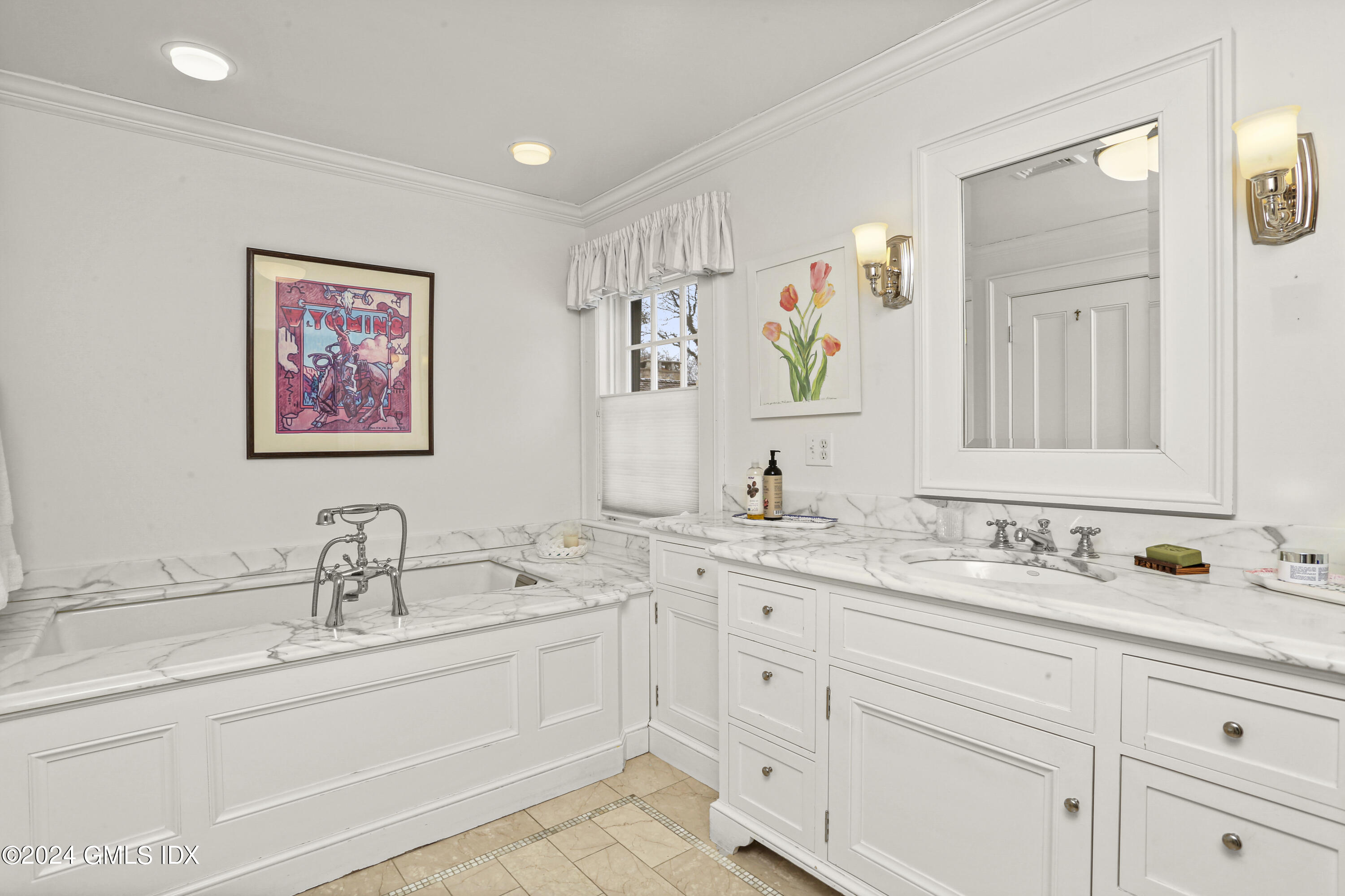 264 Taconic Road Greenwich, CT 06831 - Photo 17 of 36 a bathroom with double sink and a mirror