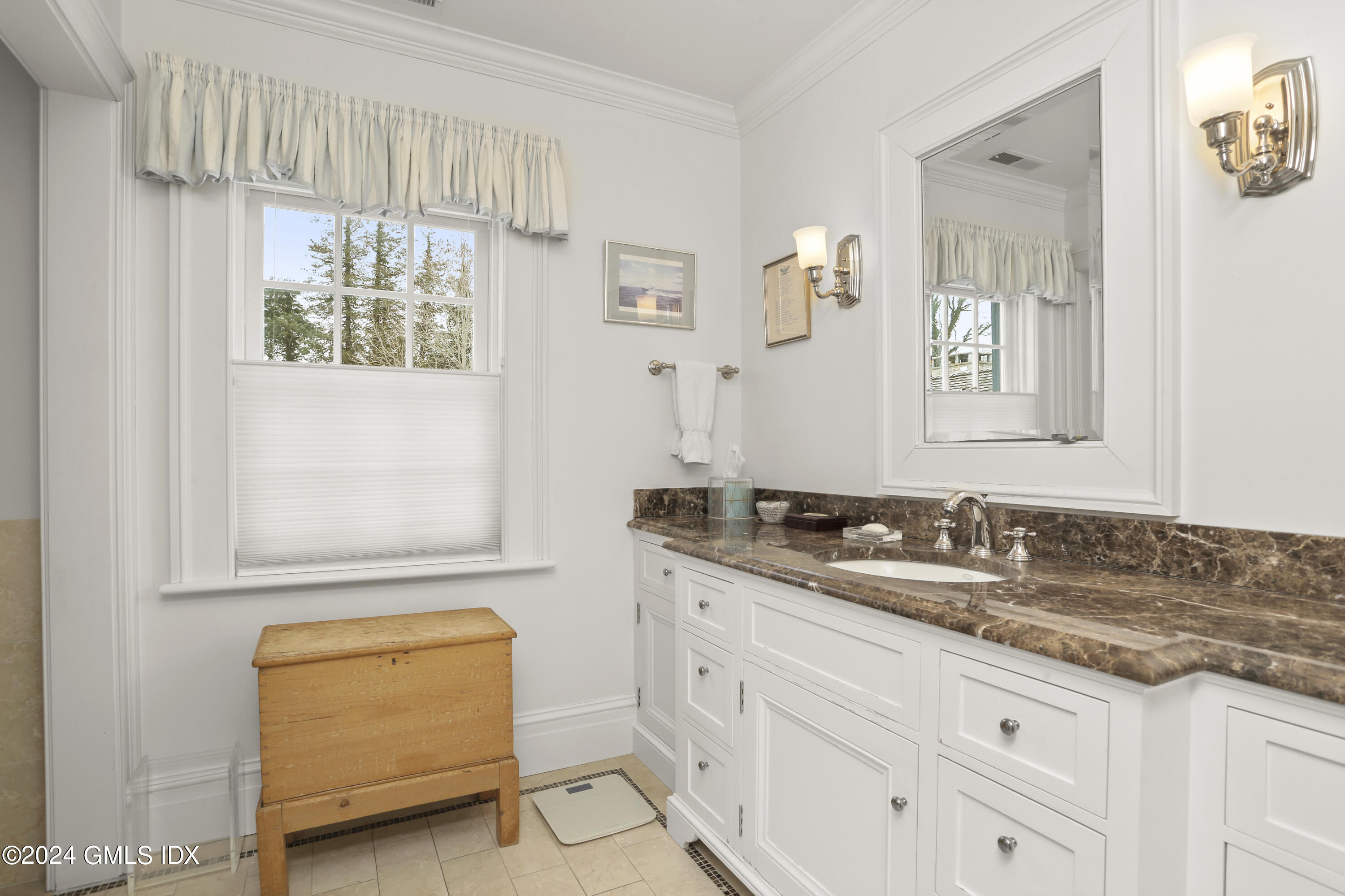 264 Taconic Road Greenwich, CT 06831 - Photo 18 of 36 a bathroom with a granite countertop sink a mirror and a bathtub