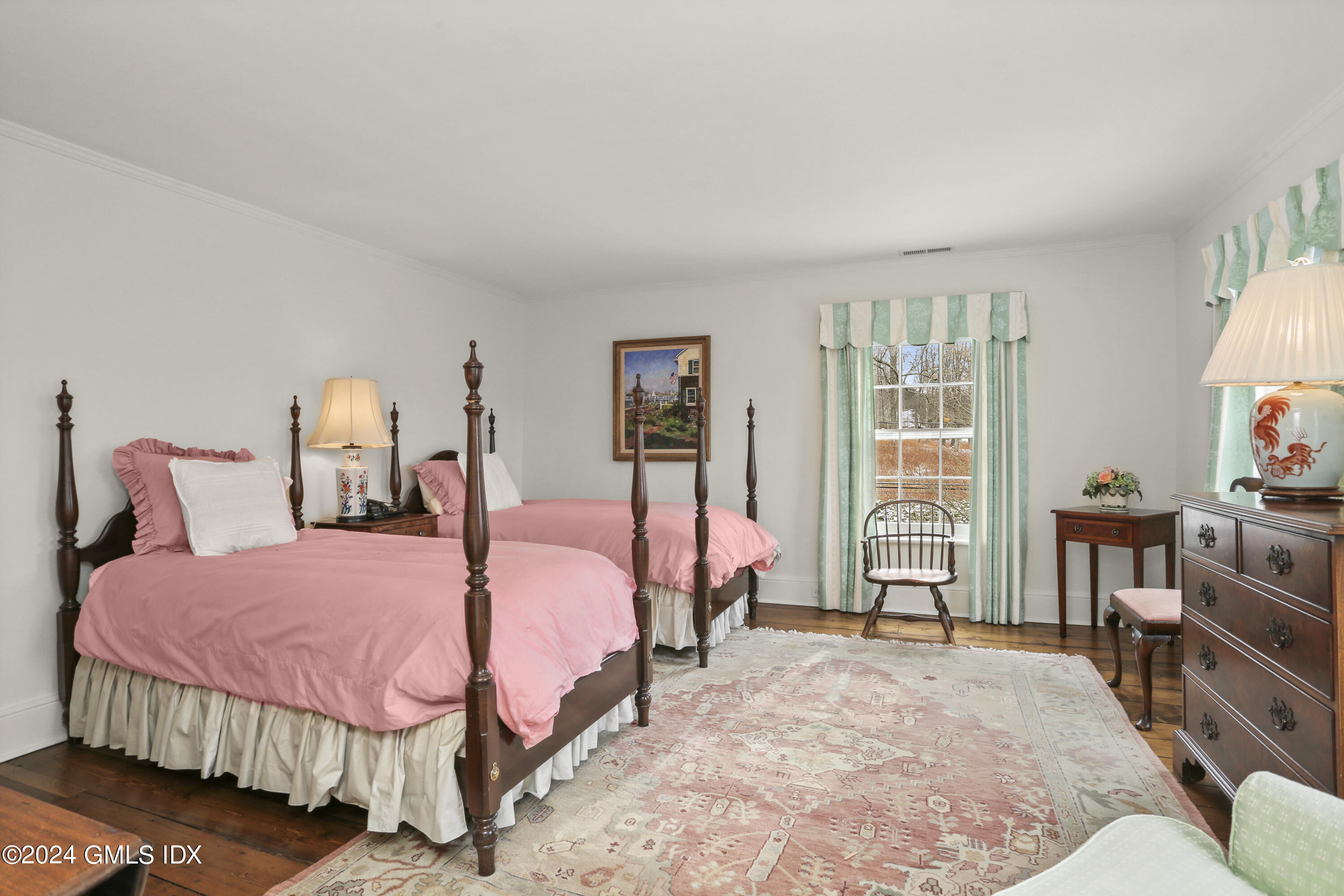 264 Taconic Road Greenwich, CT 06831 - Photo 20 of 36 a bedroom with a bed and wooden floor