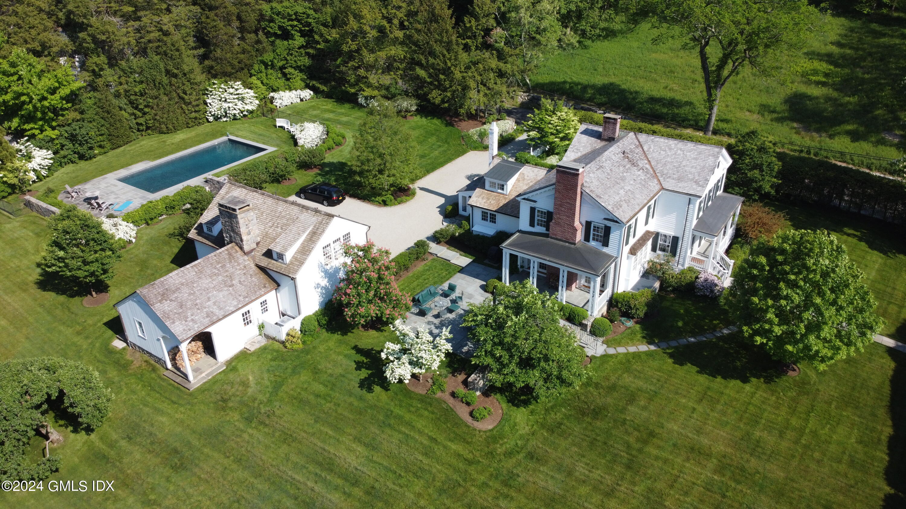 264 Taconic Road Greenwich, CT 06831 - Photo 2 of 36 an aerial view of a house with a garden