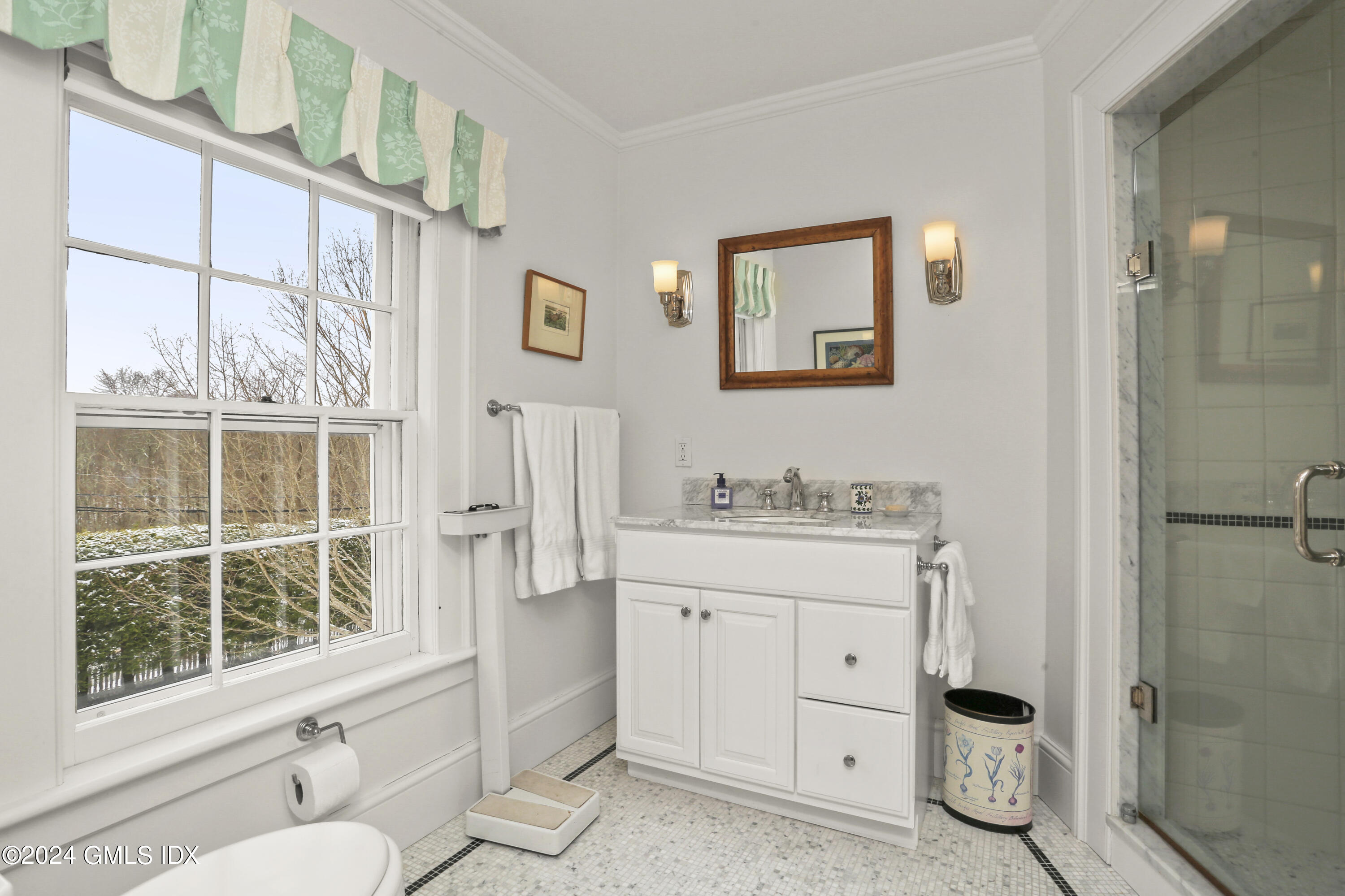 264 Taconic Road Greenwich, CT 06831 - Photo 21 of 36 a bathroom with a granite countertop toilet a sink and a window