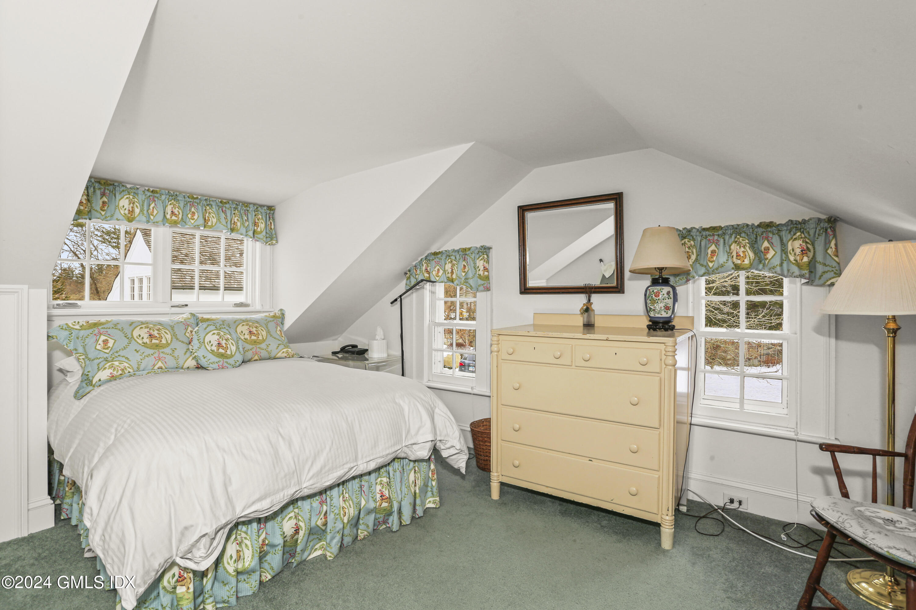 264 Taconic Road Greenwich, CT 06831 - Photo 22 of 36 a bedroom with a bed and a window