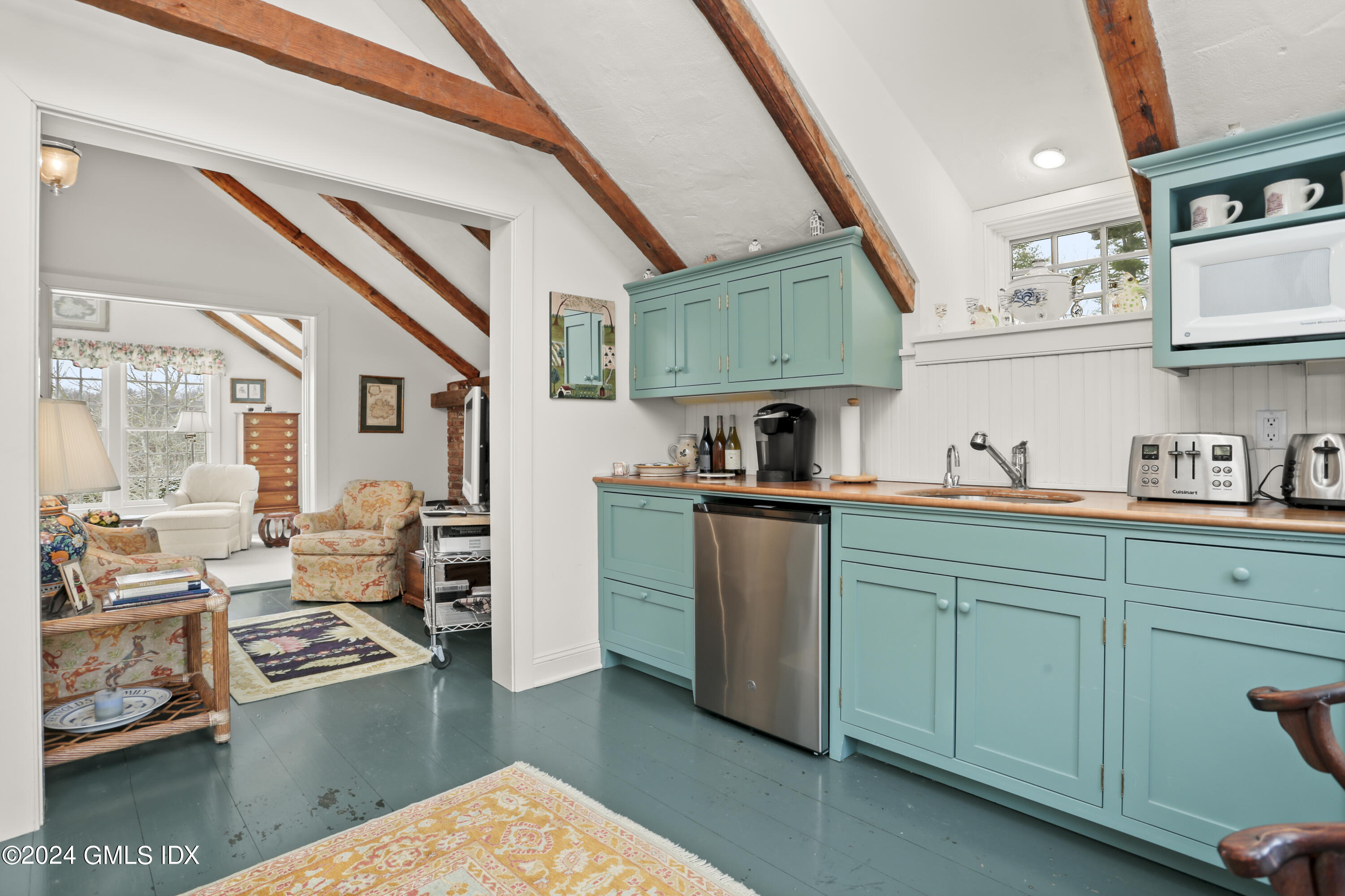 264 Taconic Road Greenwich, CT 06831 - Photo 25 of 36 a kitchen with cabinets a sink and a stove