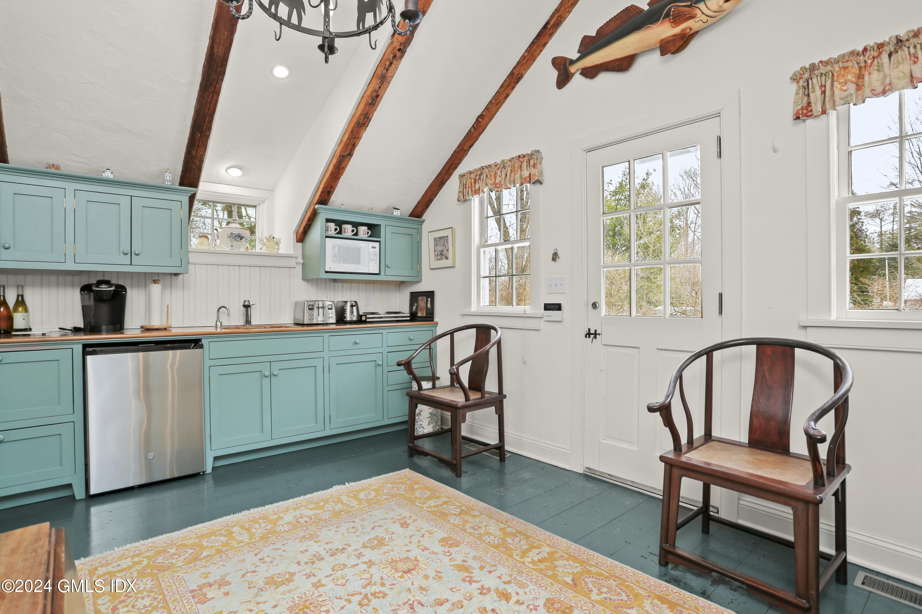 264 Taconic Road Greenwich, CT 06831 - Photo 26 of 36 a kitchen with sink refrigerator and window