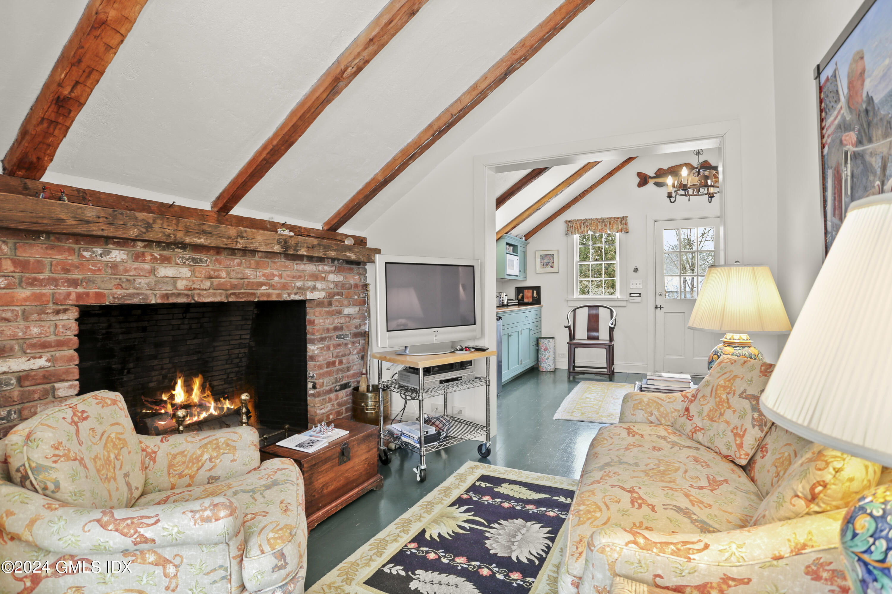 264 Taconic Road Greenwich, CT 06831 - Photo 28 of 36 a living room with furniture and a fireplace