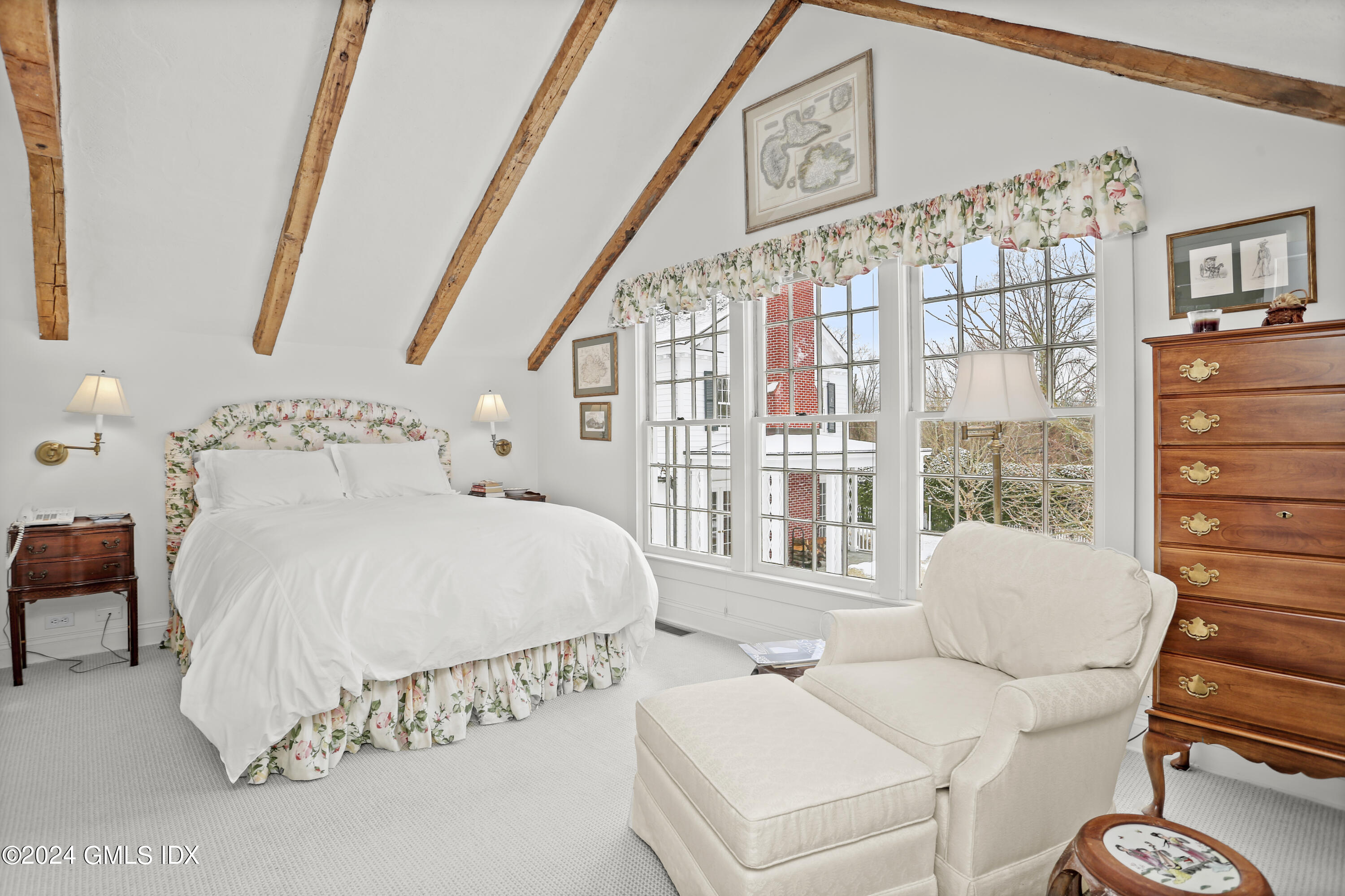 264 Taconic Road Greenwich, CT 06831 - Photo 29 of 36 a bedroom with furniture and a large window