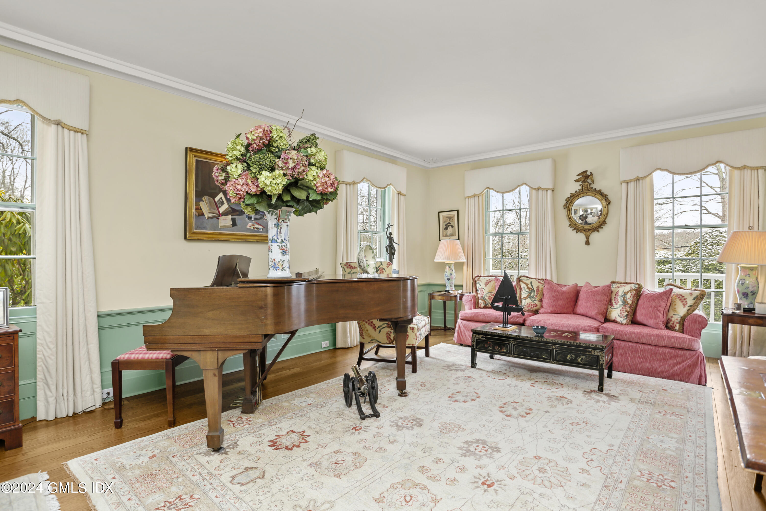 264 Taconic Road Greenwich, CT 06831 - Photo 5 of 36 a living room with furniture and a dining table