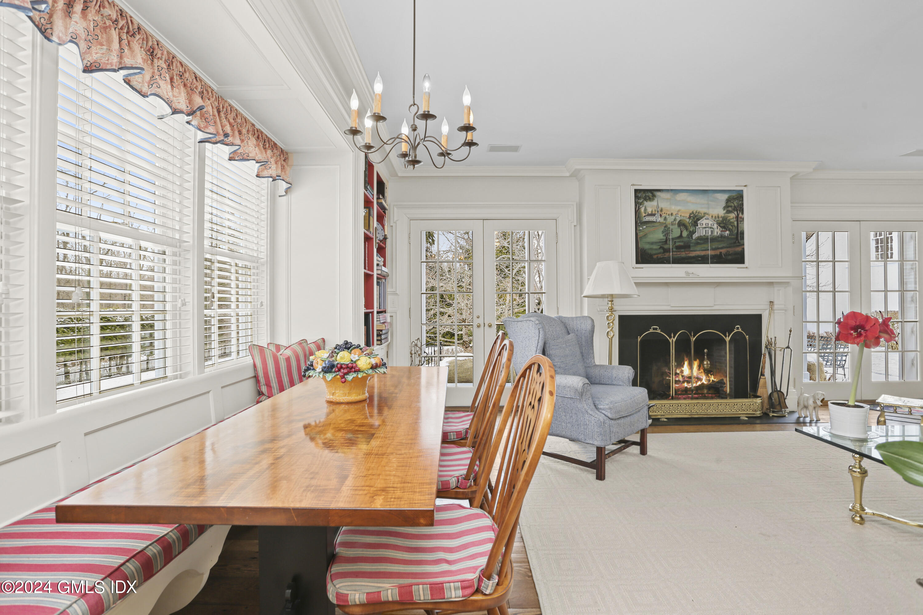 264 Taconic Road Greenwich, CT 06831 - Photo 9 of 36 a living room with furniture a chandelier and a fireplace