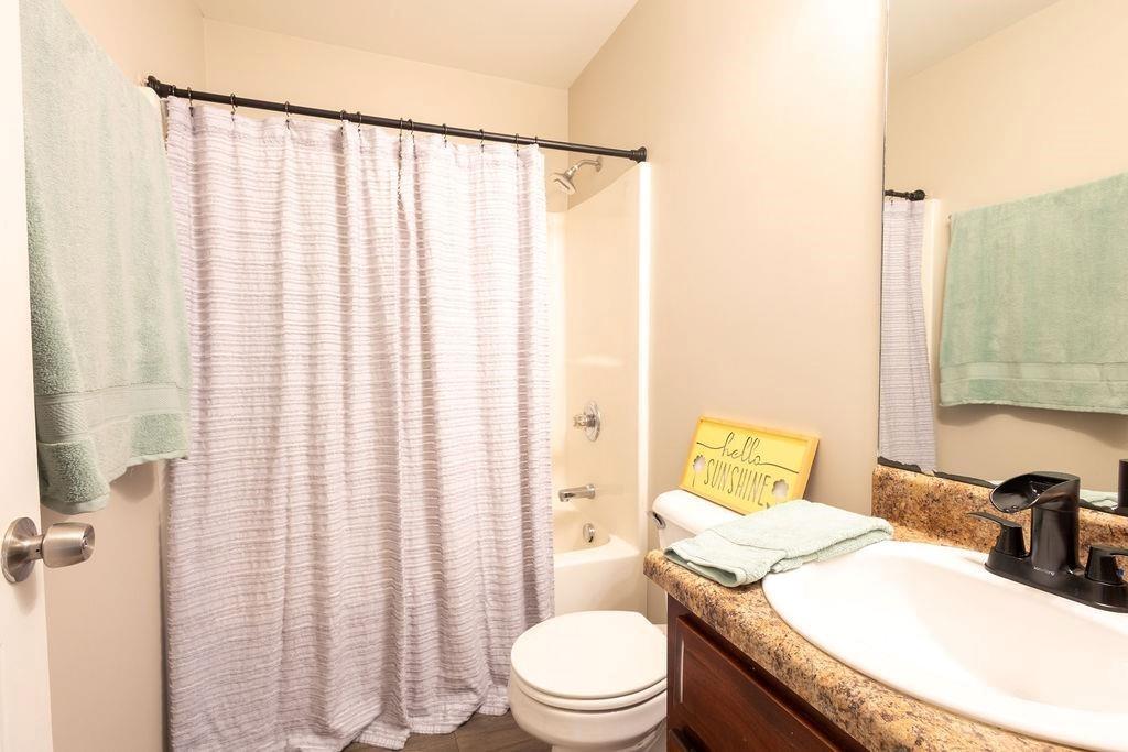 33 Northwest Hunters Glenn Road Northwest Rome, GA 30165 - Photo 11 of 19 a bathroom with a granite countertop sink and a toilet
