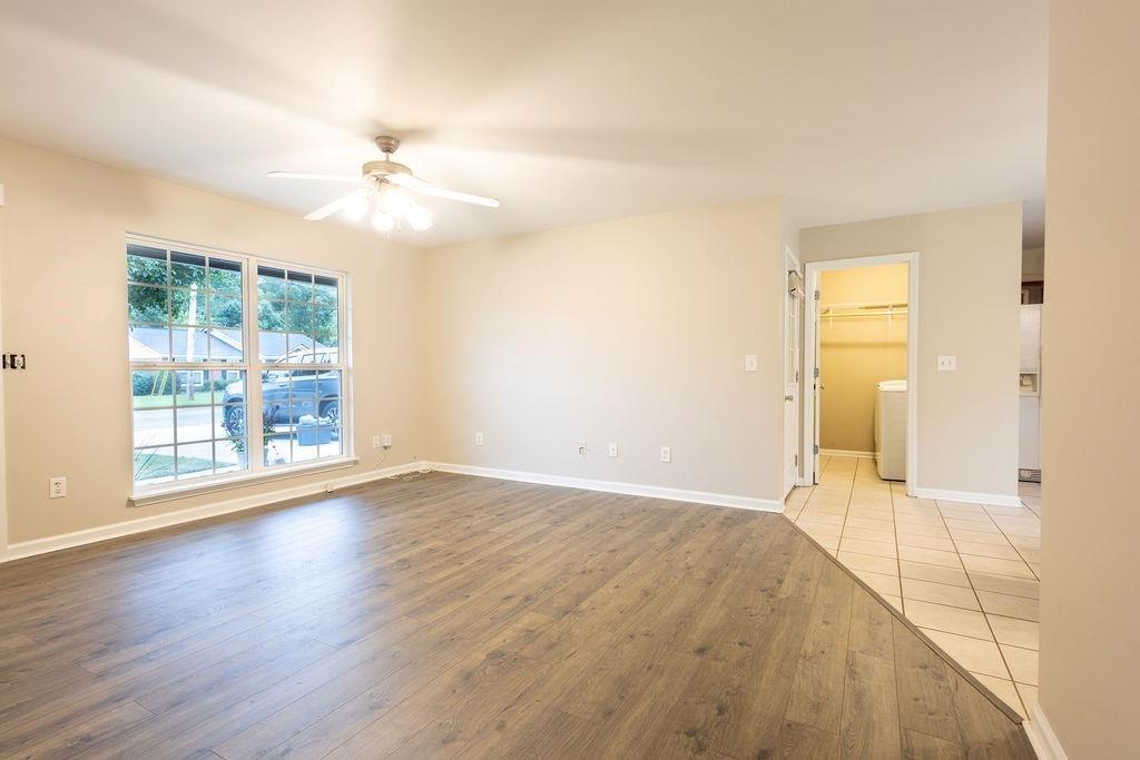 33 Northwest Hunters Glenn Road Northwest Rome, GA 30165 - Photo 2 of 19 a view of an empty room with wooden floor and a window