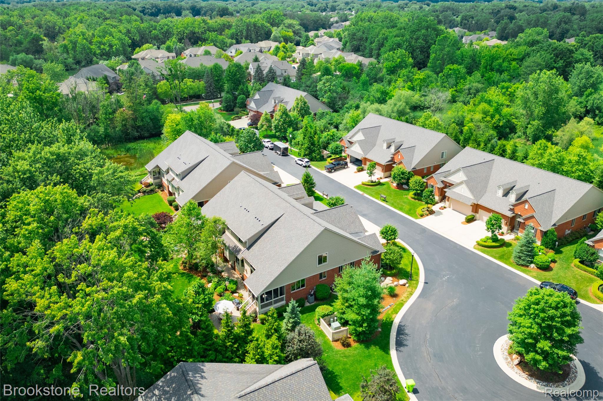 2167 Sanctuary Court Rochester, MI 48309 - Photo 33 of 68 Aerial perspective showcasing a residential community with lush green landscaping