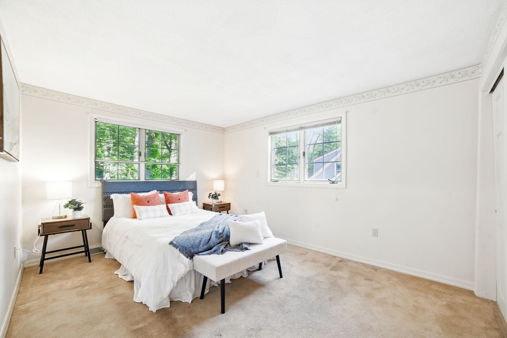 8 Ware Road Winchester, MA 01890 - Photo 11 of 25 a bedroom with furniture and a window