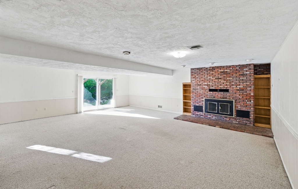 8 Ware Road Winchester, MA 01890 - Photo 13 of 25 a view of empty room with a fireplace
