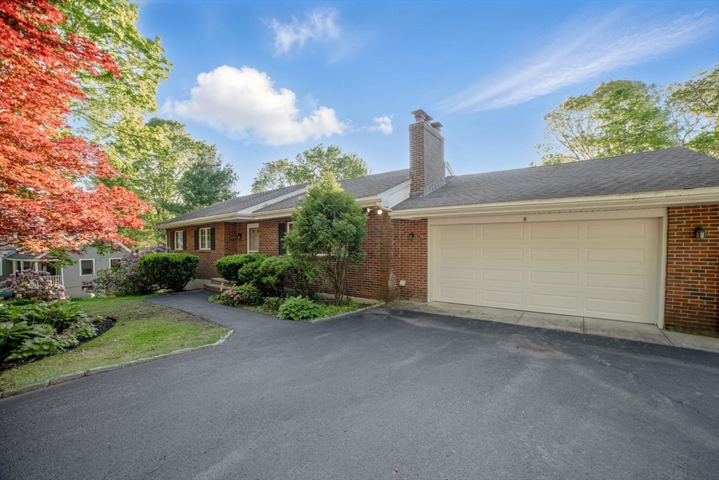 8 Ware Road Winchester, MA 01890 - Photo 19 of 25 a view of a house with a yard and potted plants