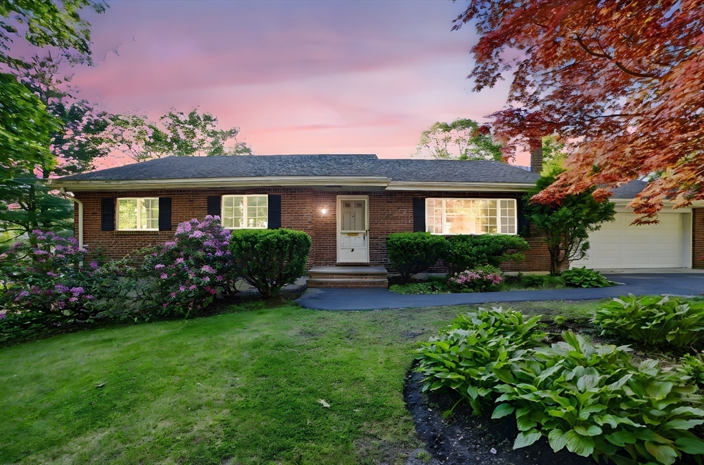 8 Ware Road Winchester, MA 01890 - Photo 22 of 25 a front view of a house with a garden