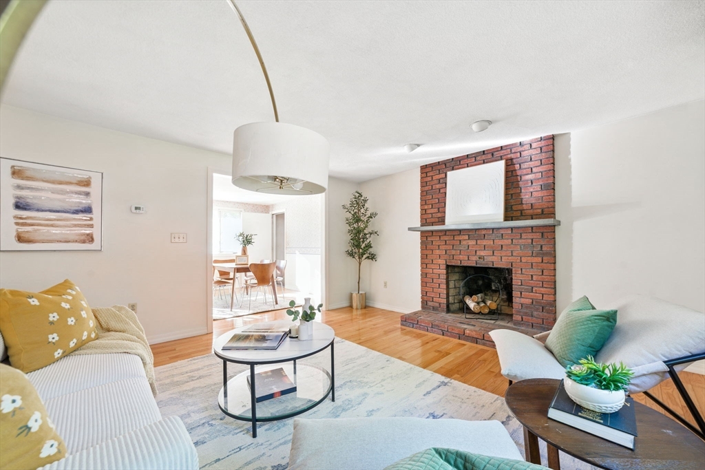 8 Ware Road Winchester, MA 01890 - Photo 3 of 25 a living room with furniture and a fireplace
