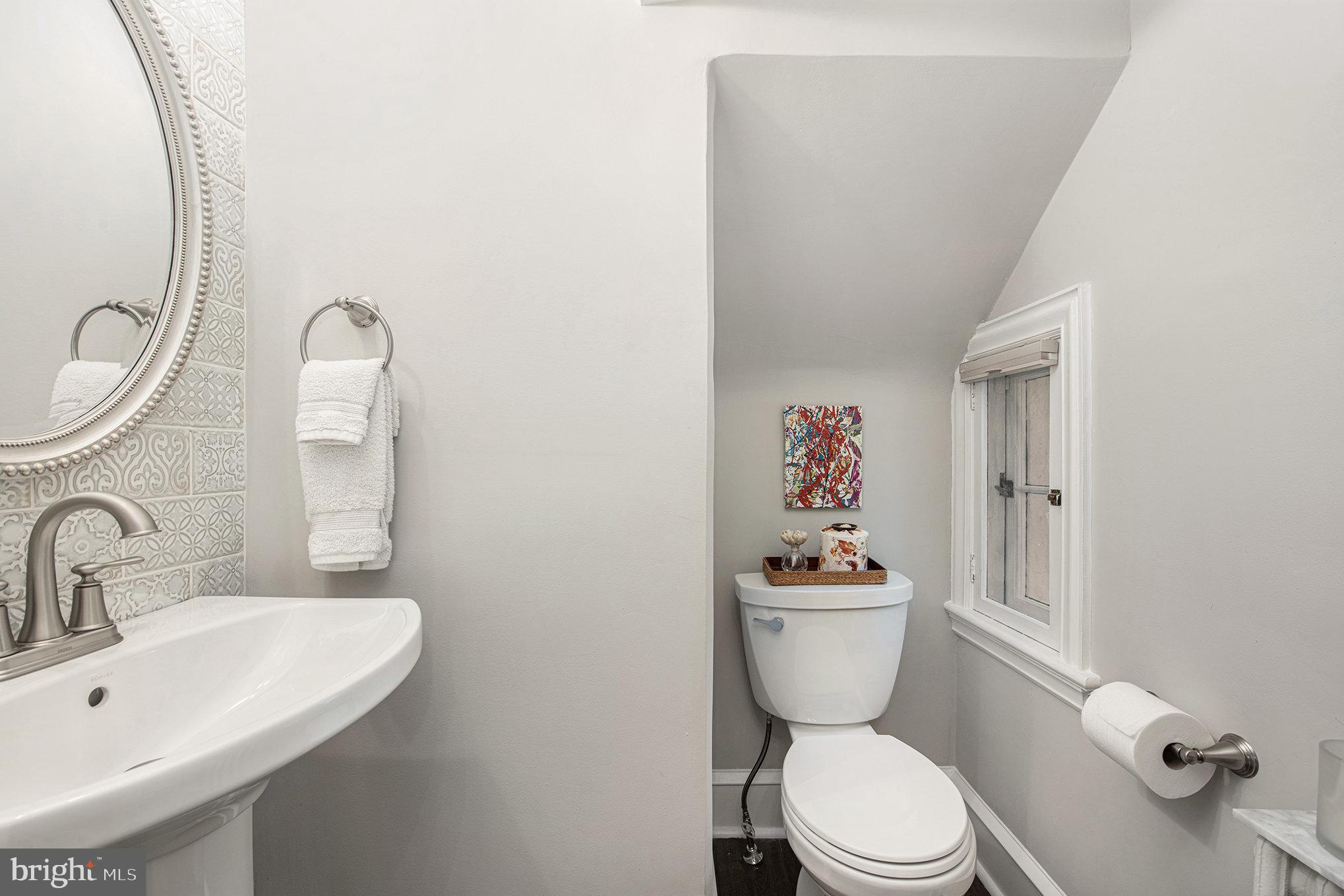 109 Willowburn Road Villanova, PA 19085 - Photo 27 of 65 a bathroom with a toilet a sink and mirror
