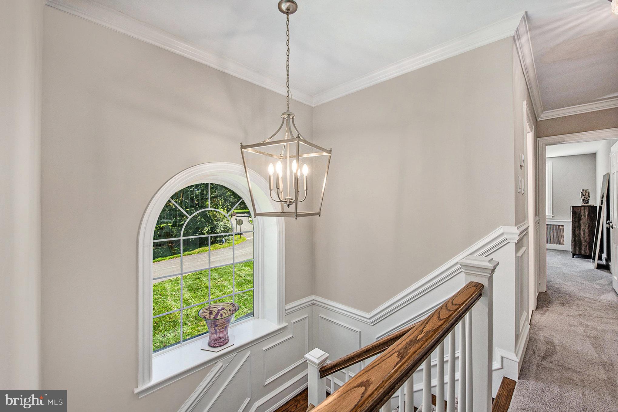109 Willowburn Road Villanova, PA 19085 - Photo 29 of 65 a view of an entryway with wooden floor and chandelier