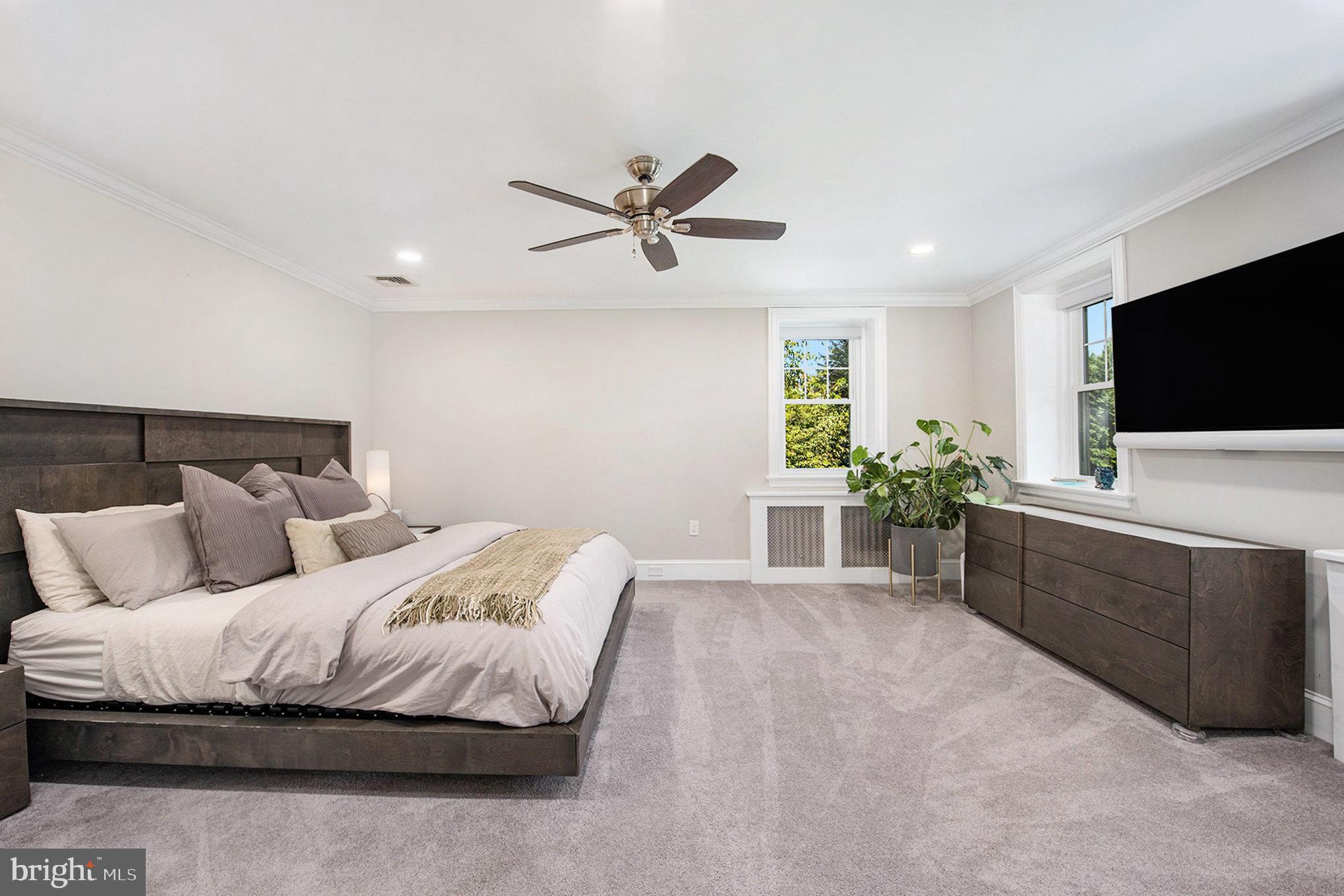 109 Willowburn Road Villanova, PA 19085 - Photo 30 of 65 a spacious bedroom with a bed and a flat screen tv