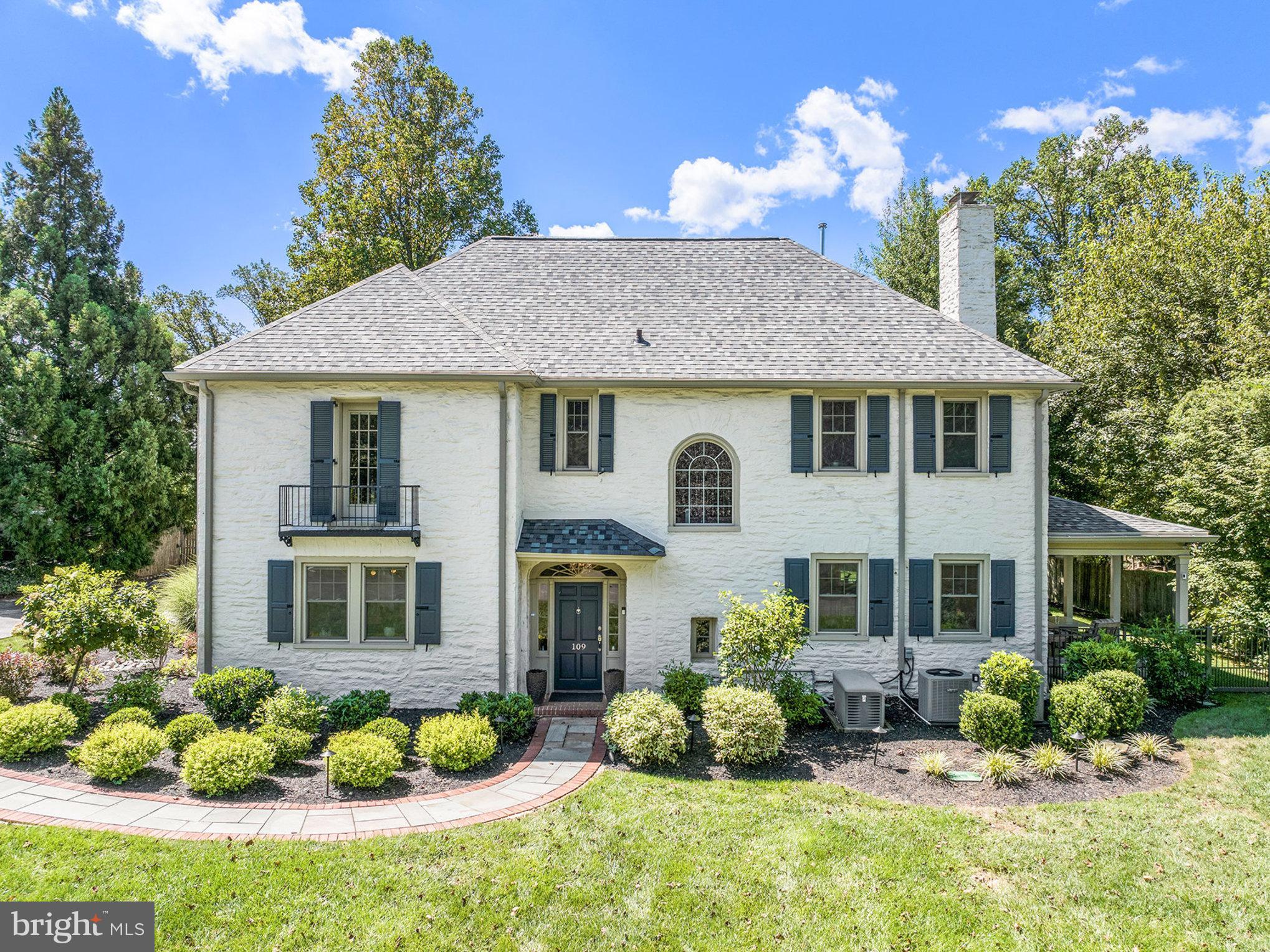 109 Willowburn Road Villanova, PA 19085 - Photo 3 of 65 a front view of a house with a yard and potted plants