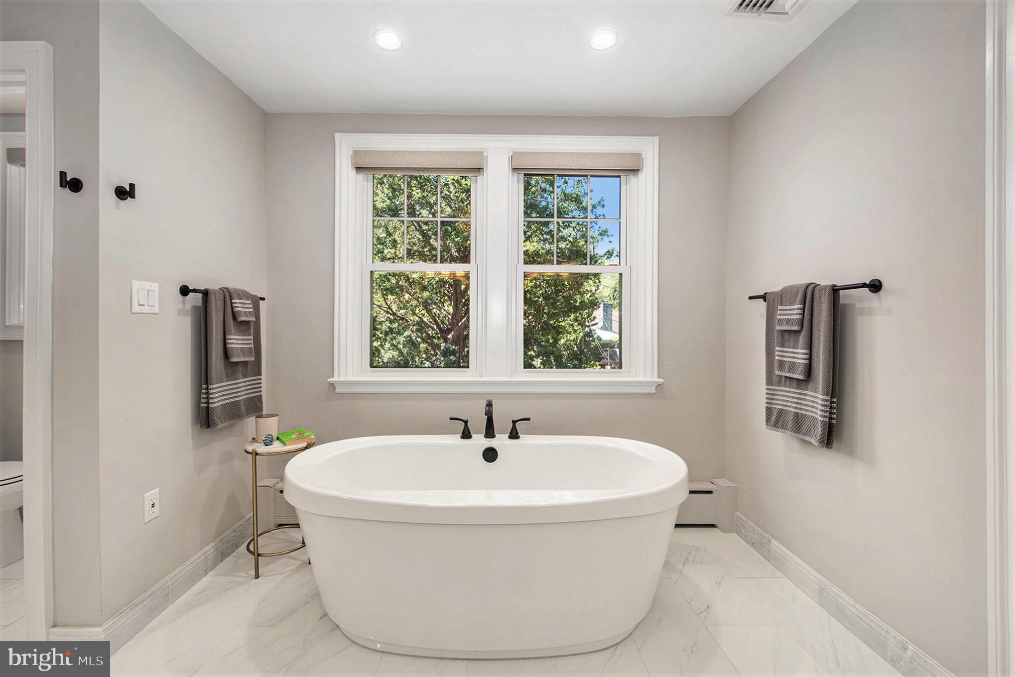 109 Willowburn Road Villanova, PA 19085 - Photo 37 of 65 a white bath tub sitting next to a window