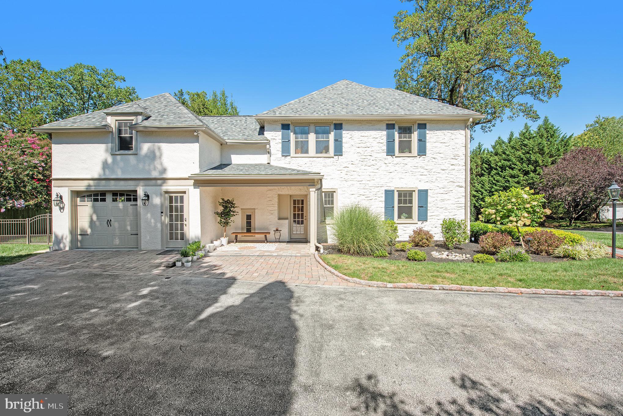 109 Willowburn Road Villanova, PA 19085 - Photo 4 of 65 a front view of a house with a yard and porch