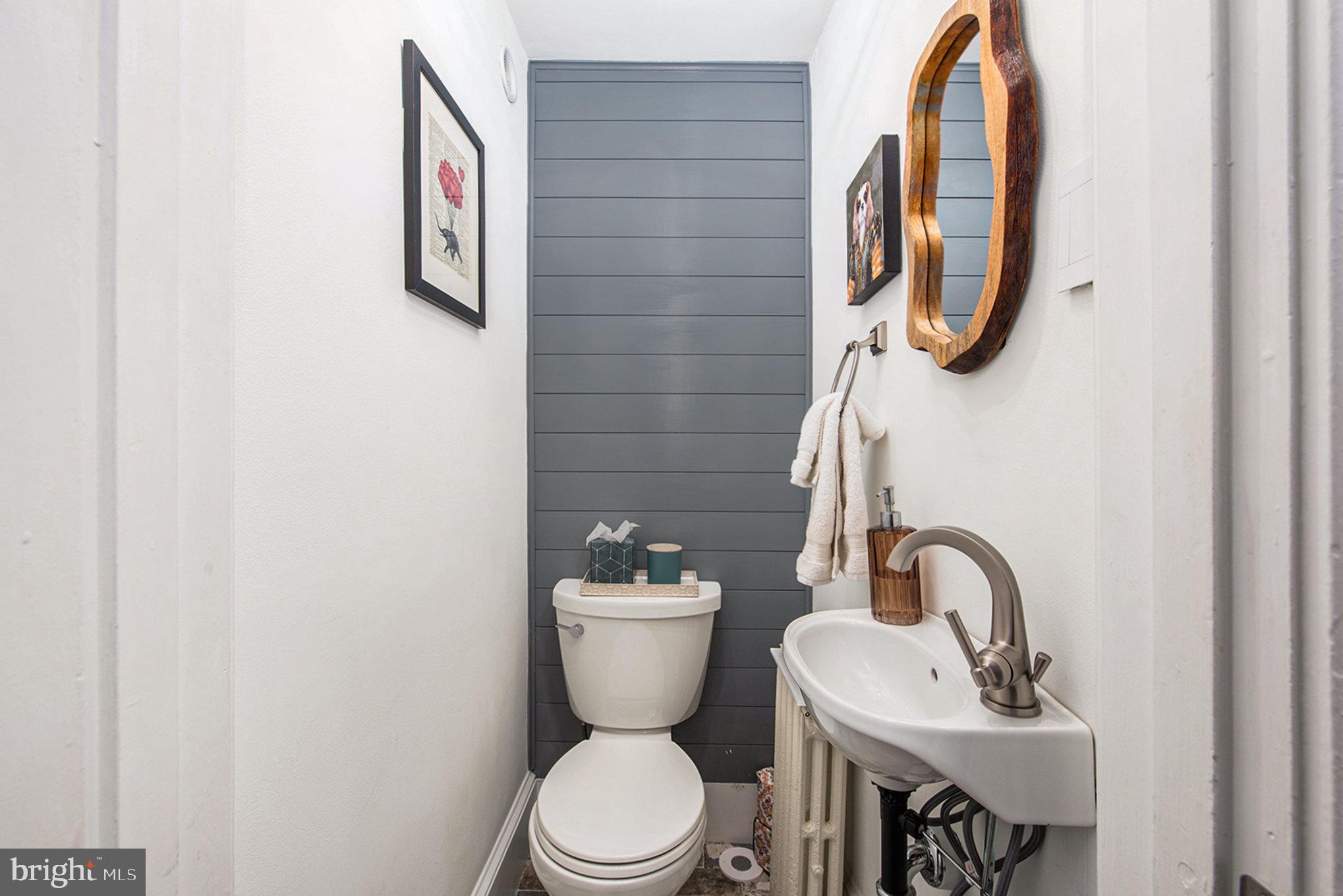 109 Willowburn Road Villanova, PA 19085 - Photo 47 of 65 a bathroom with a toilet sink and mirror
