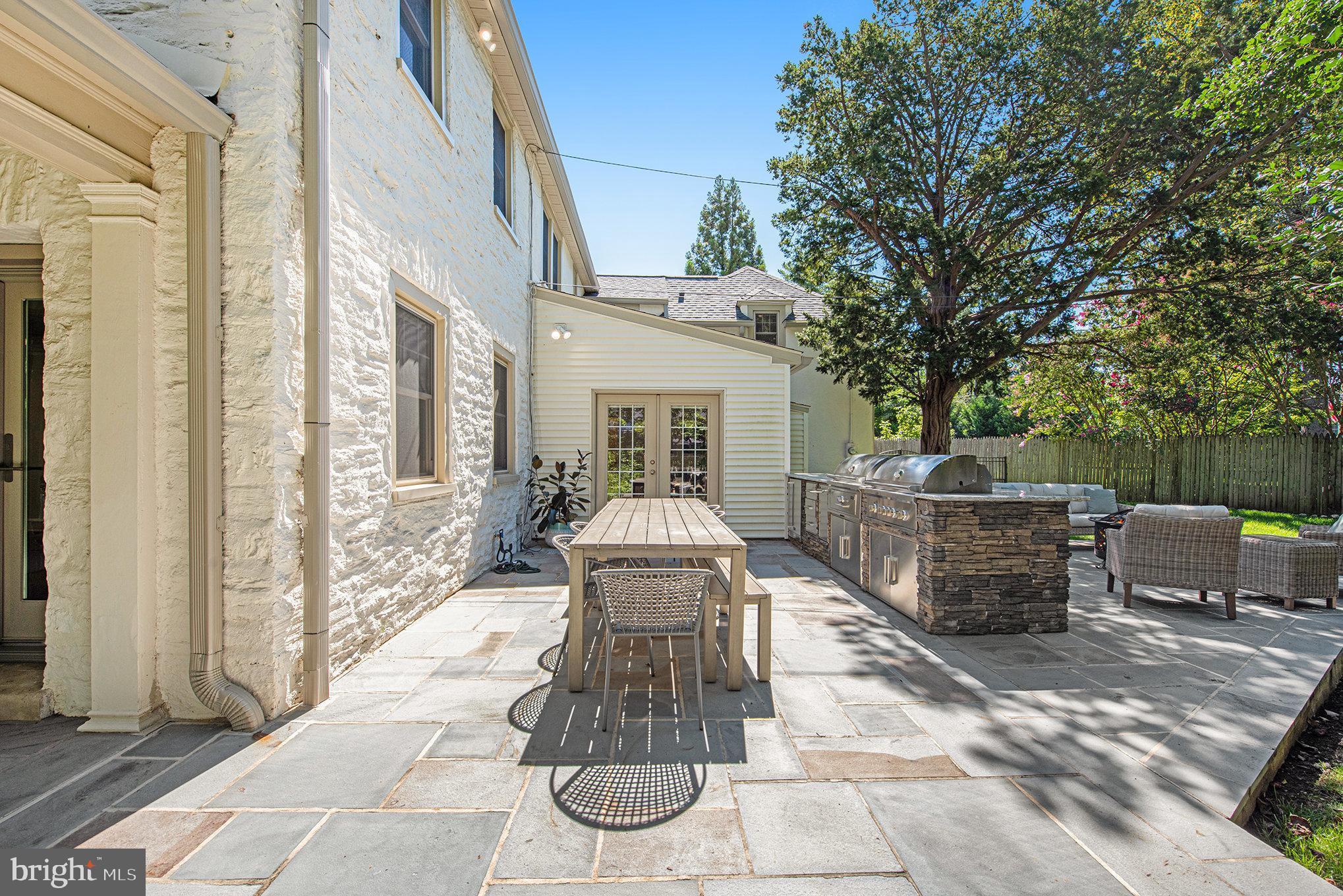 109 Willowburn Road Villanova, PA 19085 - Photo 56 of 65 a view of a patio with a table and chairs