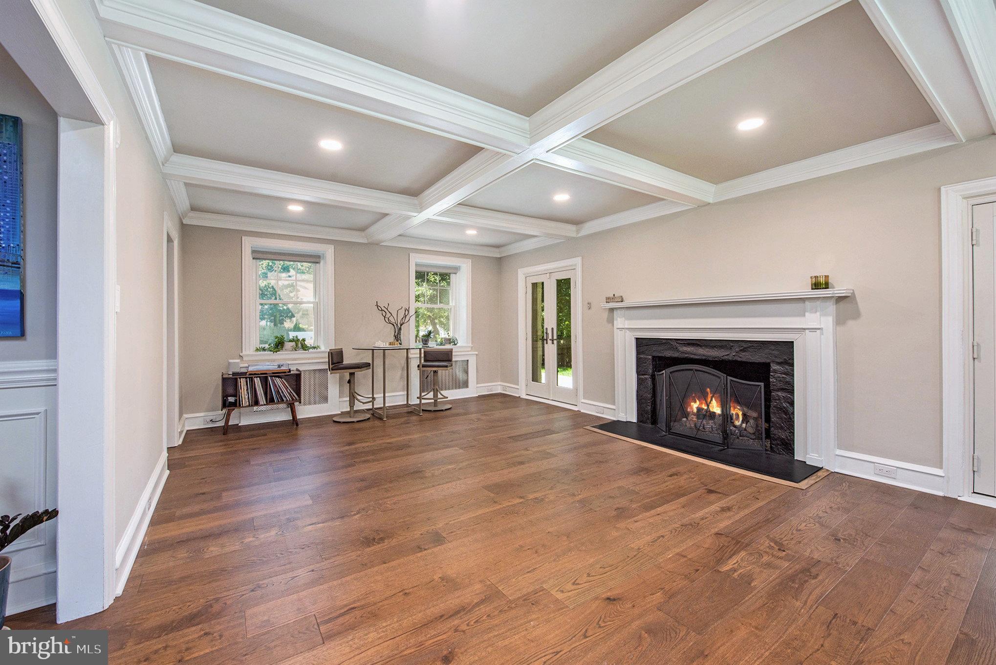 109 Willowburn Road Villanova, PA 19085 - Photo 10 of 65 a view of an empty room with wooden floor fireplace and a window