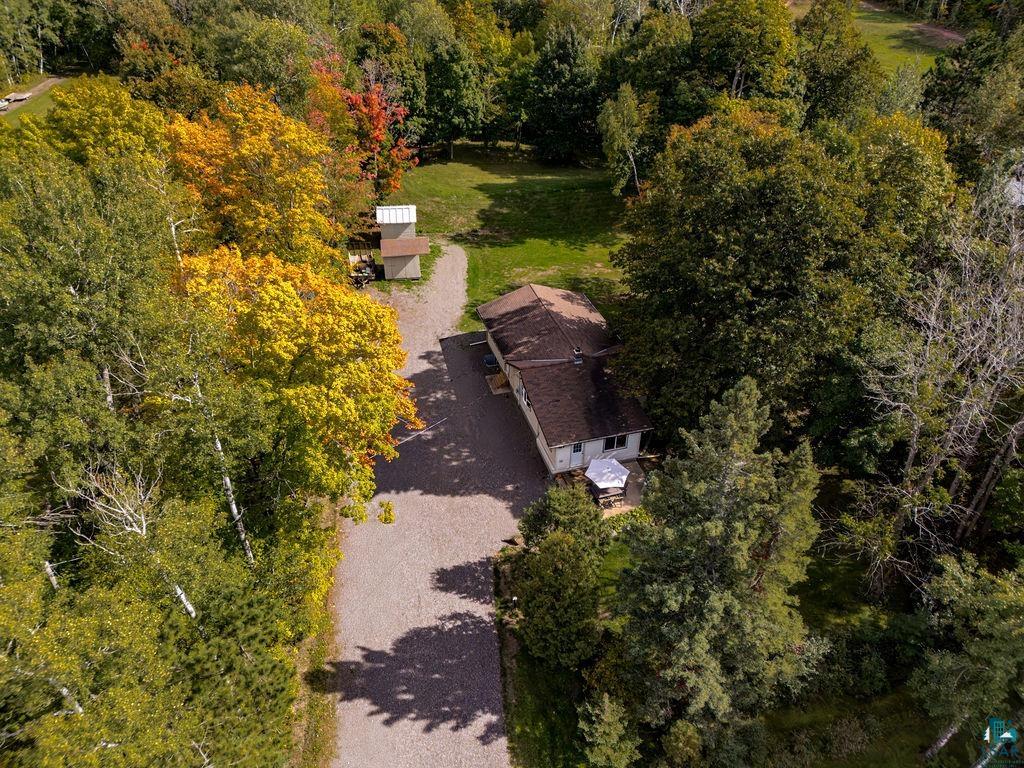 5466 Jean Duluth Road Duluth, MN 55803 - Photo 21 of 34 Extensive lot with mature trees, gravel driveway, and a private building