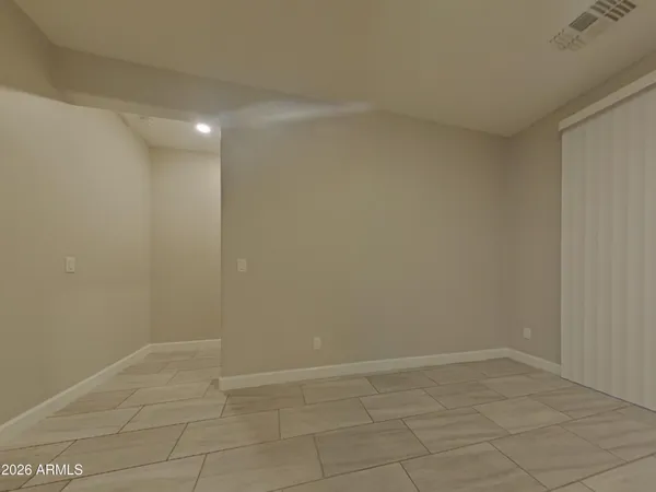 a large kitchen with a sink and cabinets