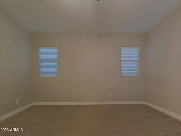 a kitchen with kitchen island granite countertop a sink a stove top oven and cabinets