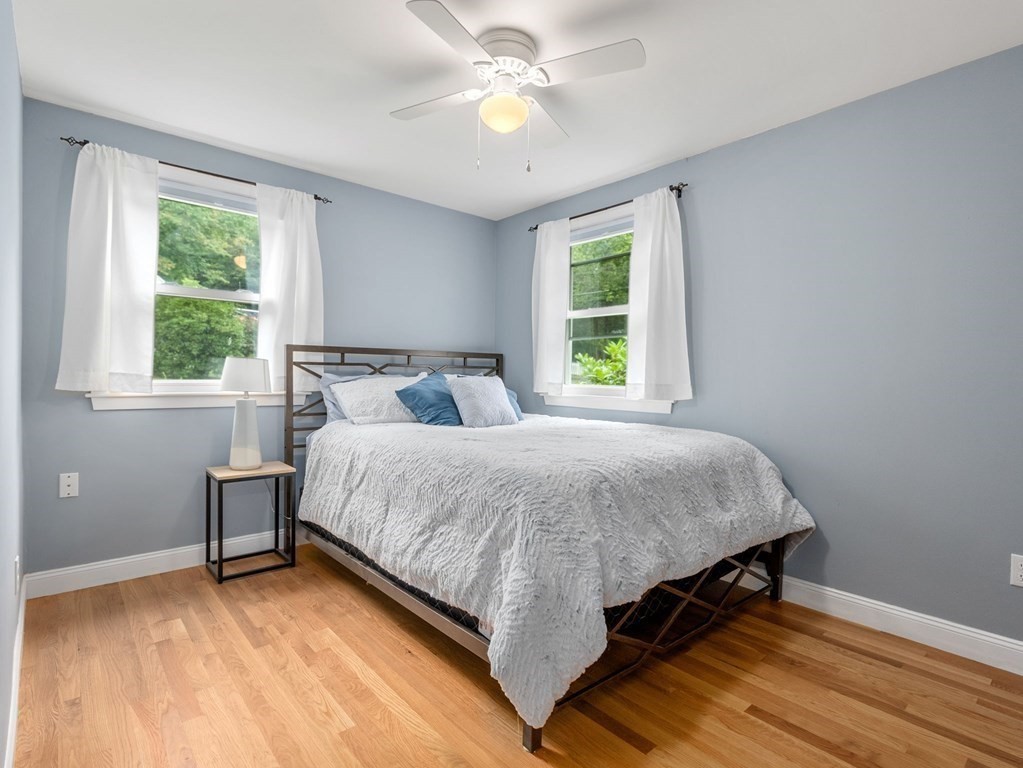 42 Priest Street Hudson, MA 01749 - Photo 11 of 23 a bed sitting in a bedroom next to a window