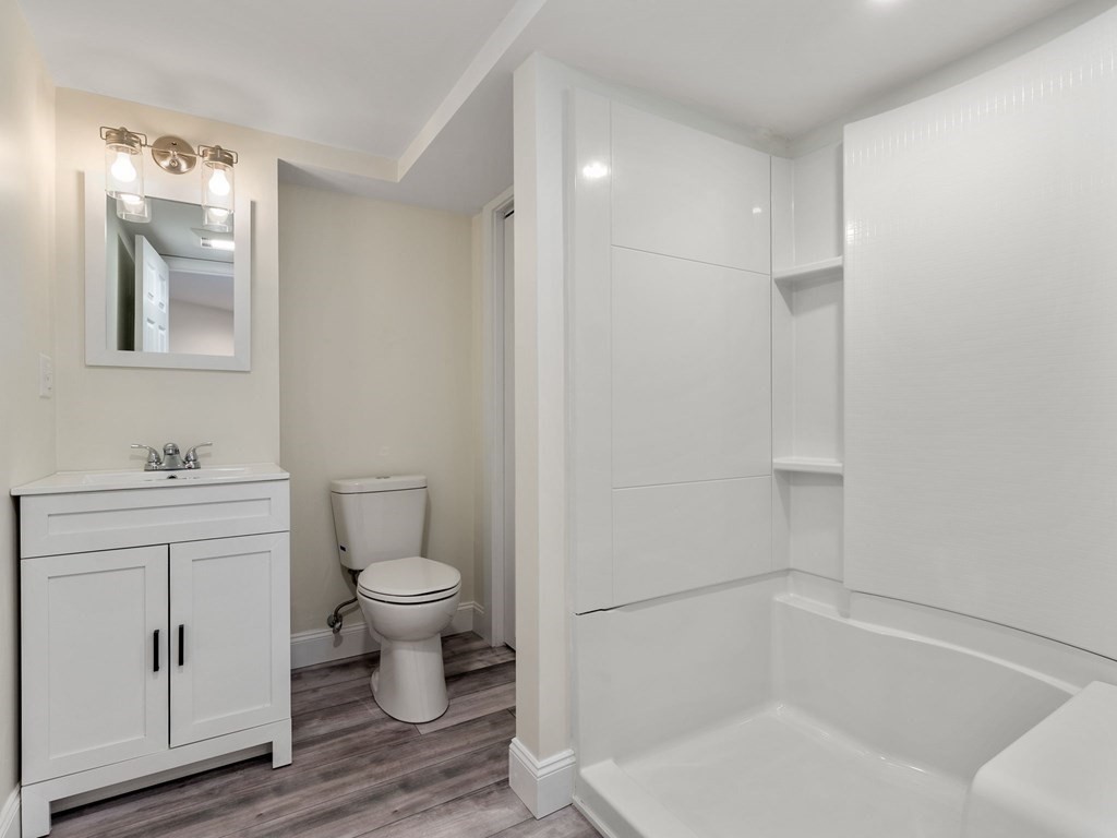 42 Priest Street Hudson, MA 01749 - Photo 16 of 23 a bathroom with a sink toilet and vanity