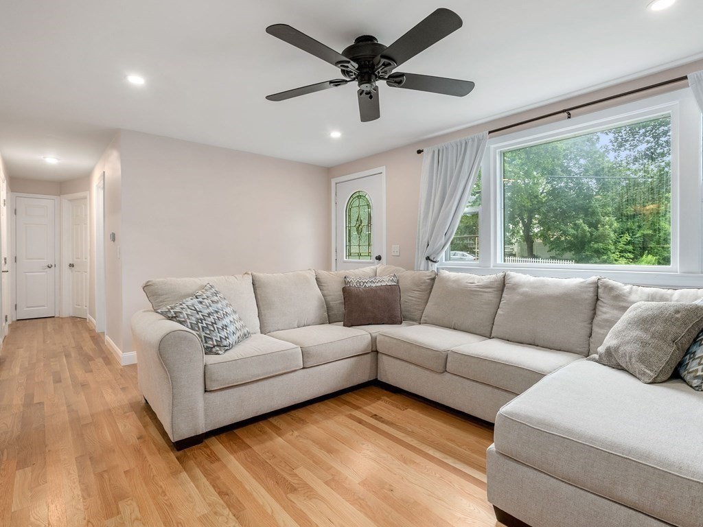 42 Priest Street Hudson, MA 01749 - Photo 4 of 23 a living room with furniture and a large window