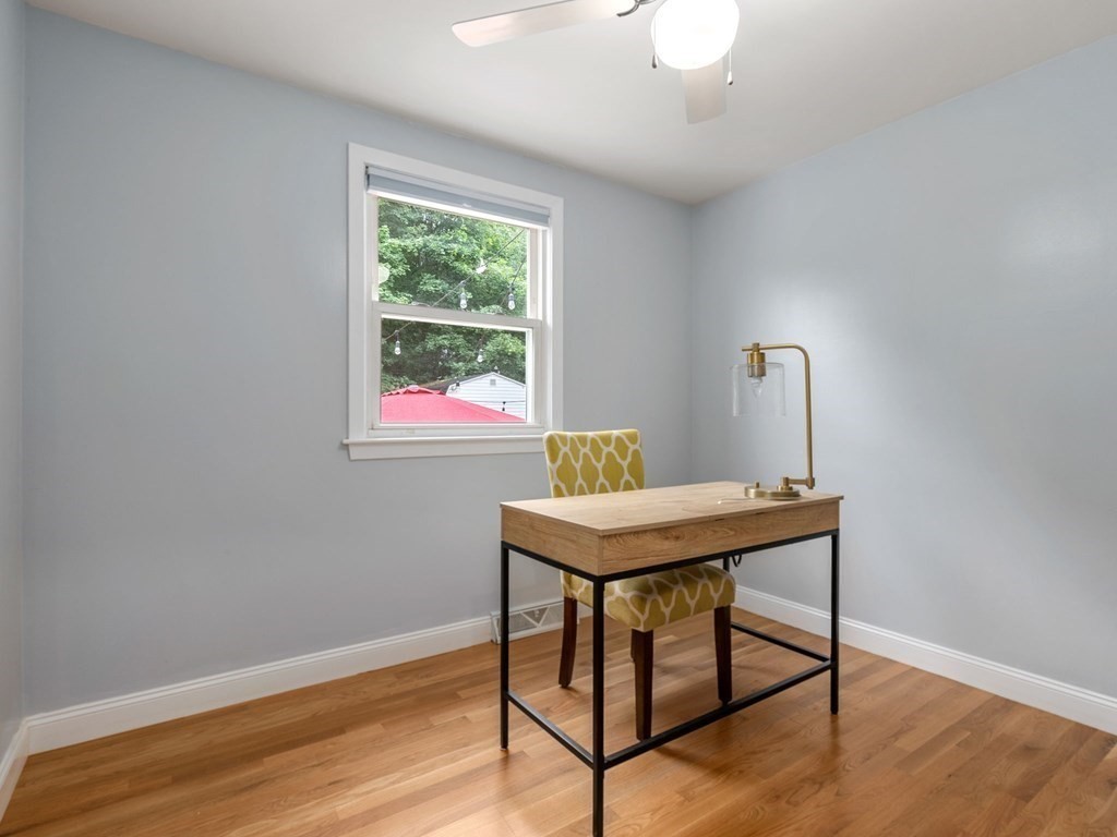 42 Priest Street Hudson, MA 01749 - Photo 9 of 23 a view of a workspace with furniture and wooden floor